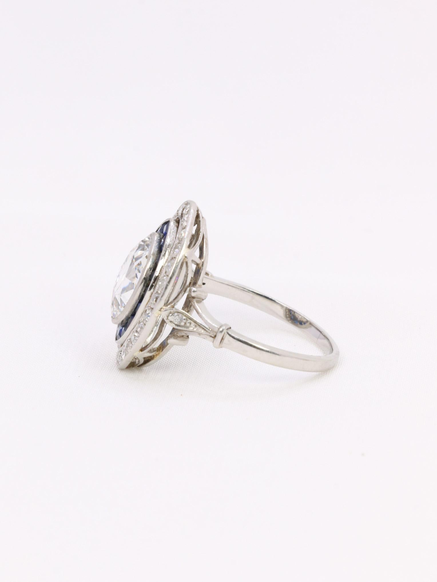Women's Old mine cut marquise diamond 2.1 ct Art Deco ring set with calibrated sapphires For Sale