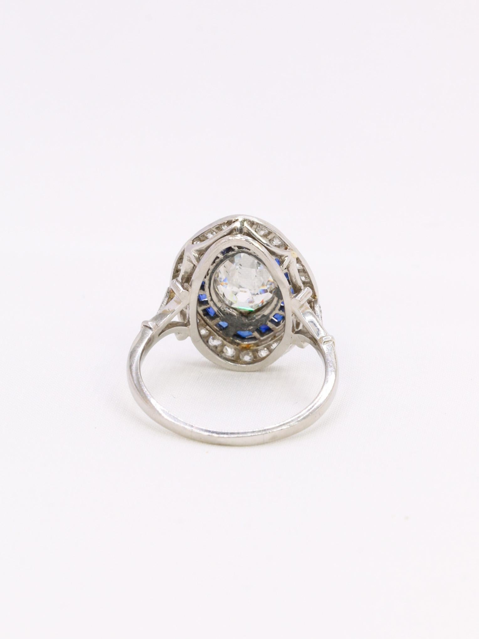 Old mine cut marquise diamond 2.1 ct Art Deco ring set with calibrated sapphires For Sale 1