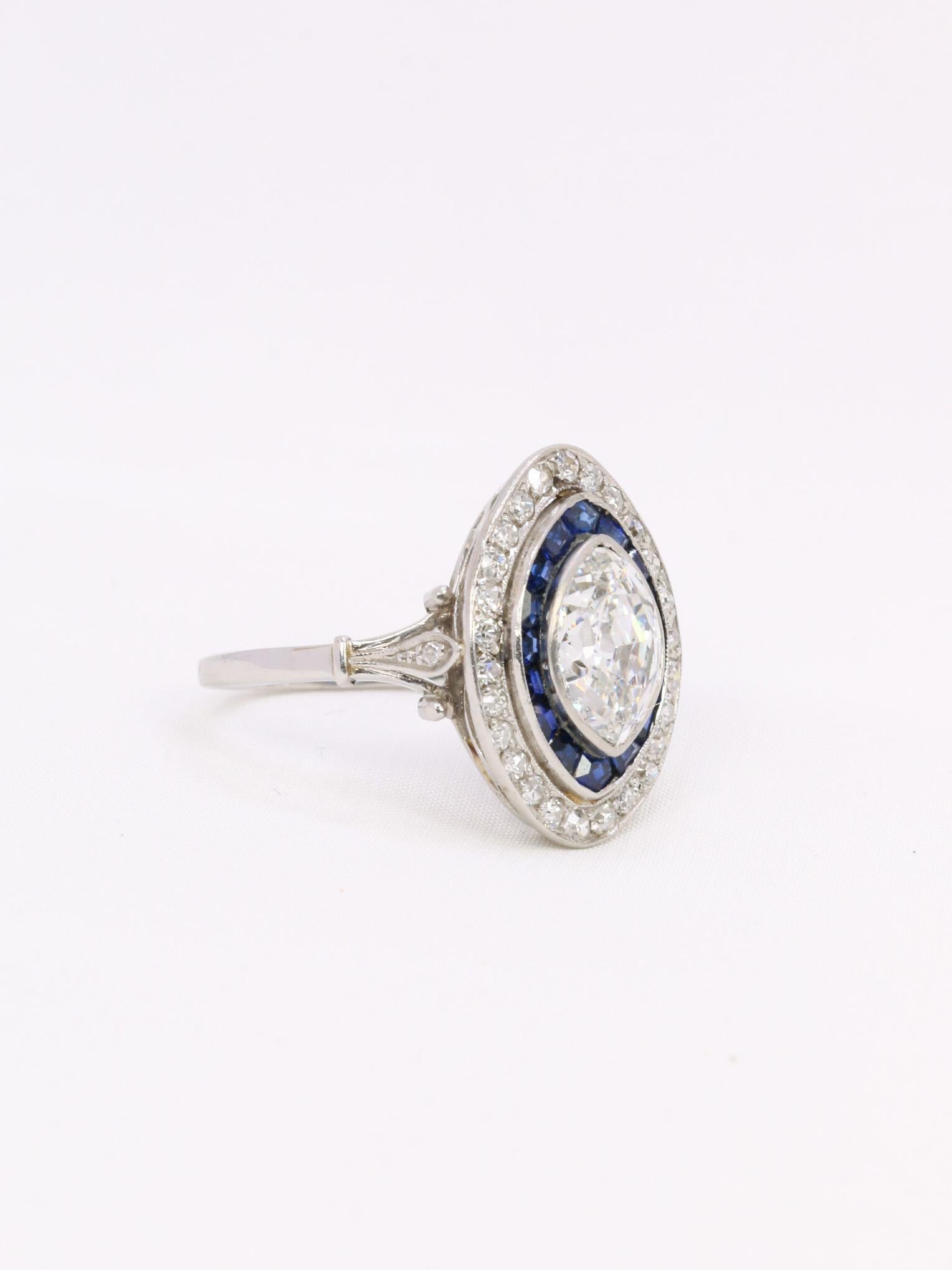 Old mine cut marquise diamond 2.1 ct Art Deco ring set with calibrated sapphires For Sale 3