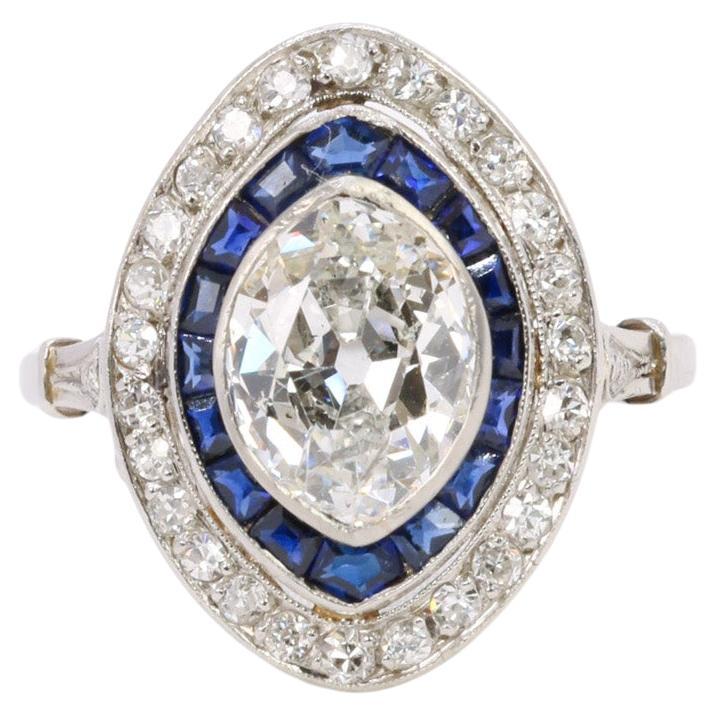 Old mine cut marquise diamond 2.1 ct Art Deco ring set with calibrated sapphires