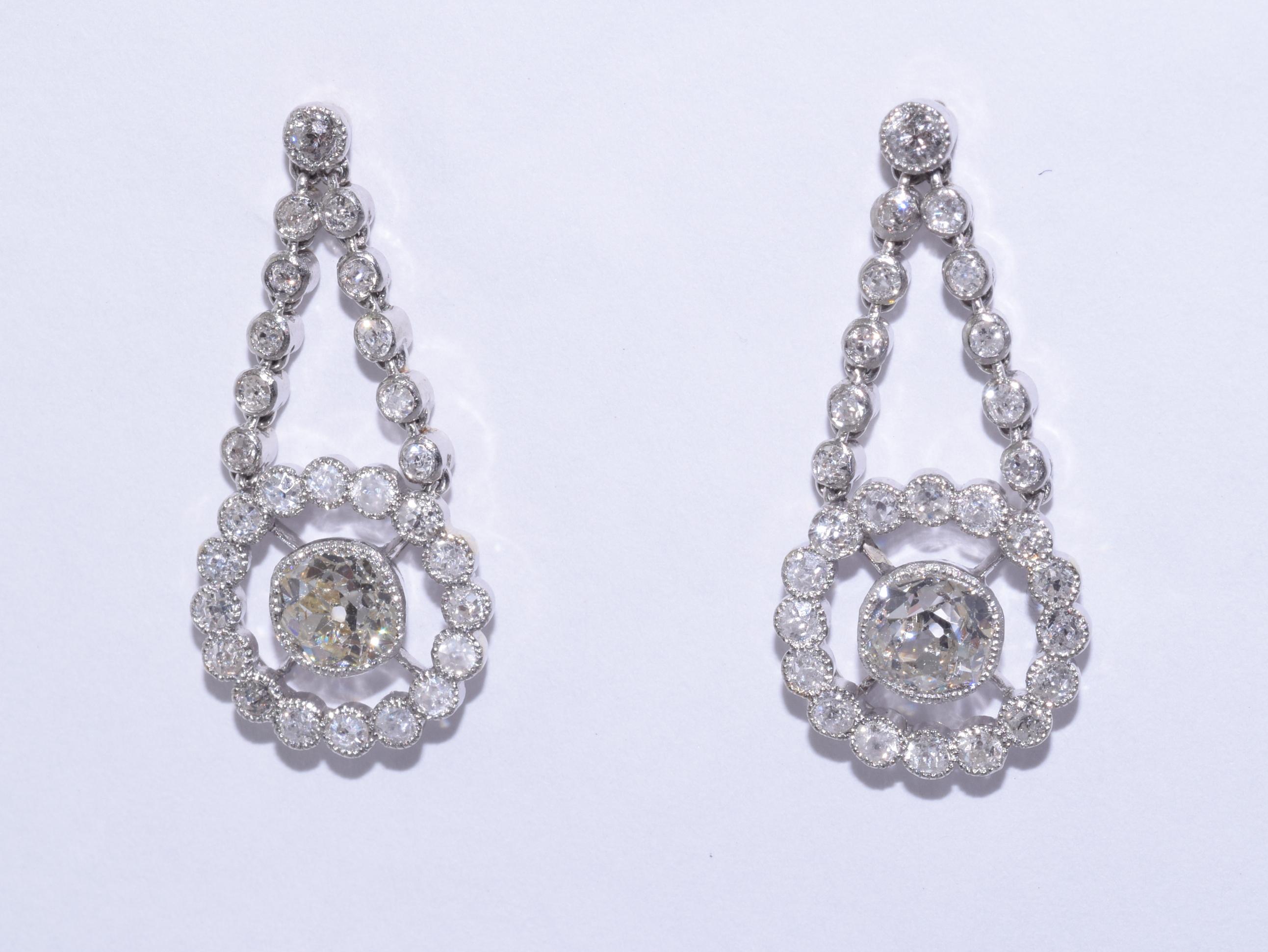 Old mine diamonds totaling approximately 0.75cts, of approximately I-L/I1 quality, are set in cluster ear pendants accented with a total of approximately
0.90ct of old mine and single cut diamonds mounted in platinum. The Edwardian elements have