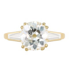 Old mine diamond flanked solitaire ring.