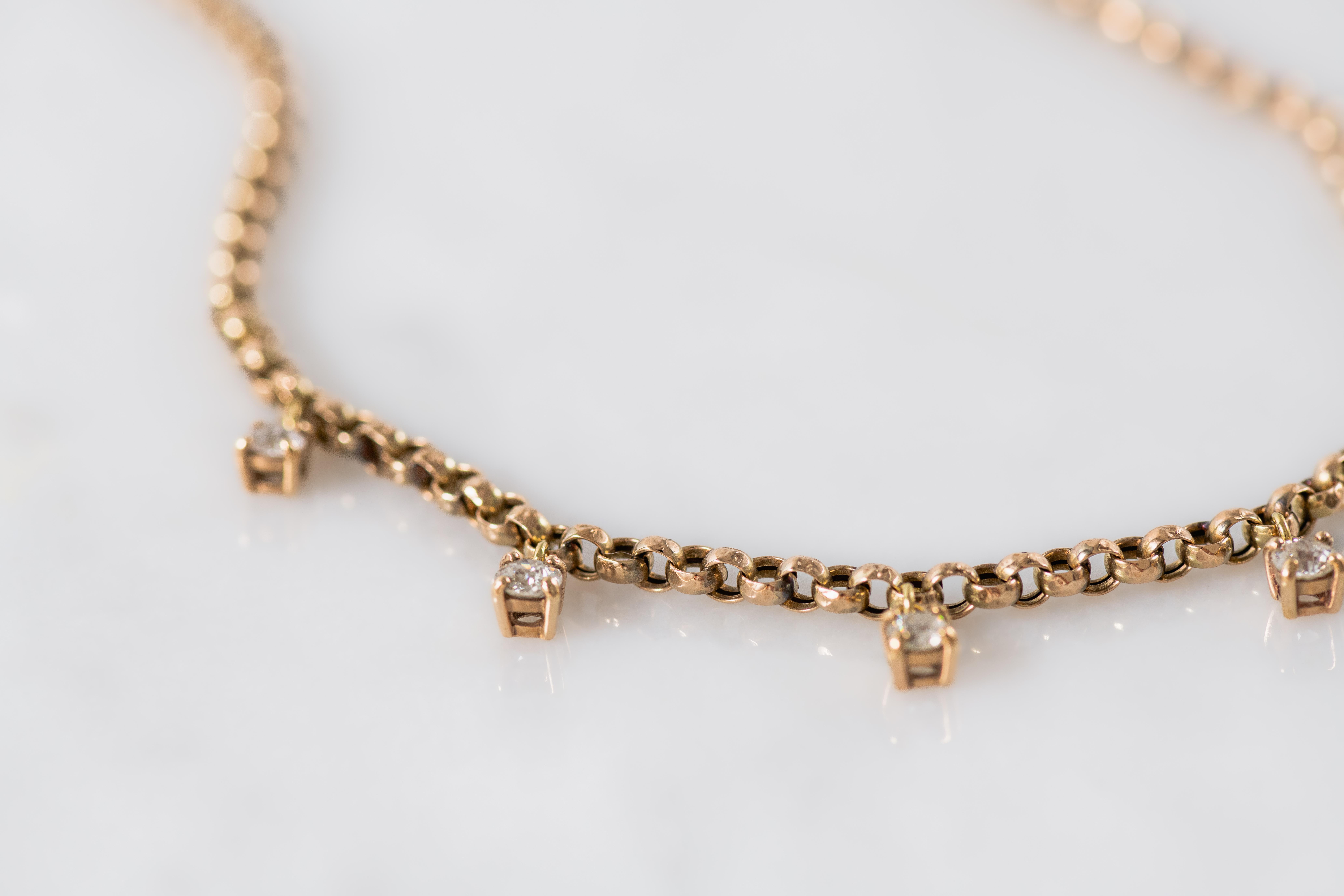 Yellow gold 9K chain, early 20th century, set with six old mine diamonds, total weight approximately 1ct.
