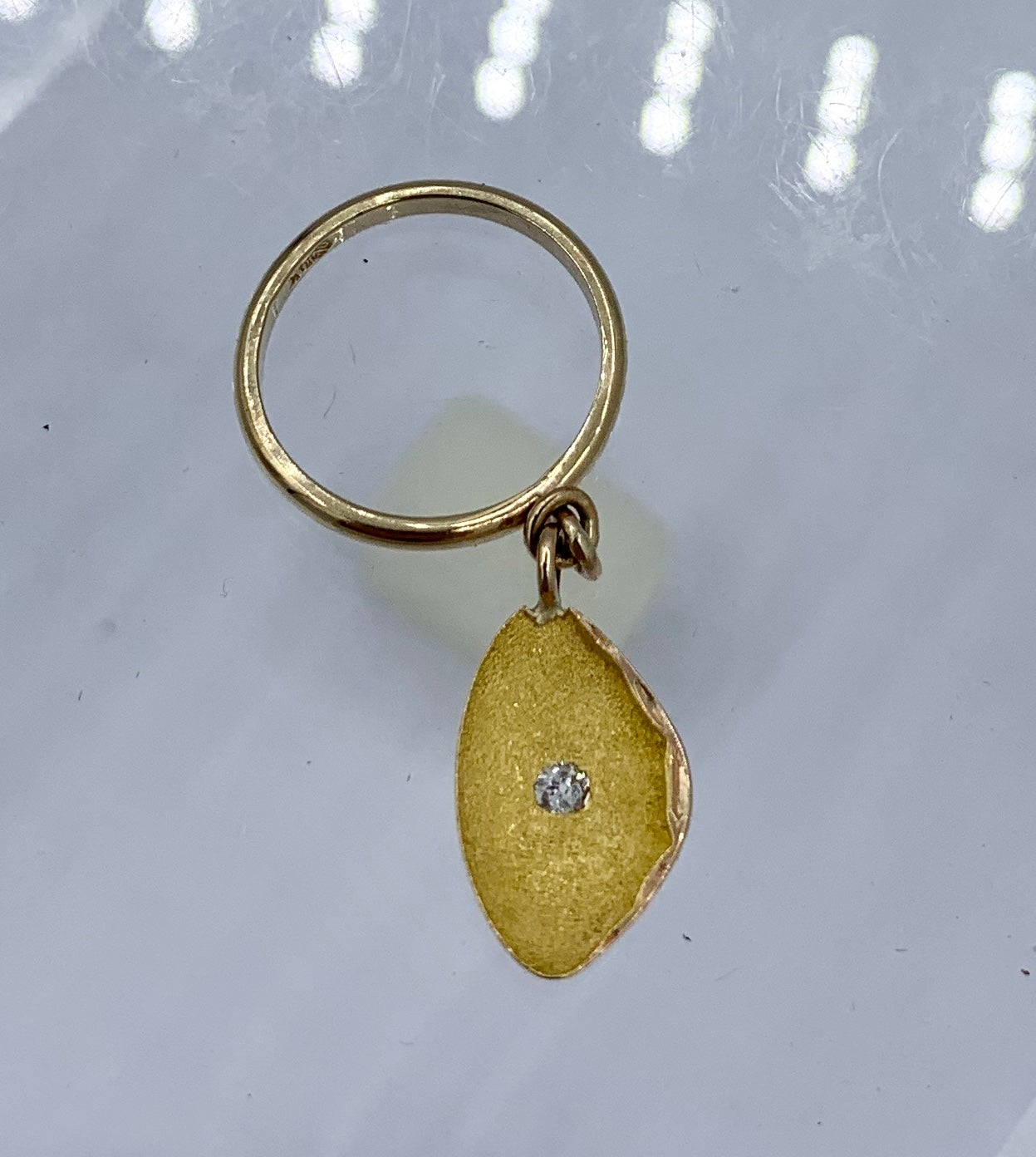 THIS IS A WONDERFUL 14 KARAT GOLD CHARM RING IN THE FORM OF AN OYSTER WITH A SPARKLING OLD MINE CUT DIAMOND.  THE ANTIQUE RING HAS A GORGEOUS OYSTER SHELL PENDANT.  THE INSIDE OF THE OYSTER HAS A FABULOUS BRUSHED GOLD FINISH AND IS SET WITH A