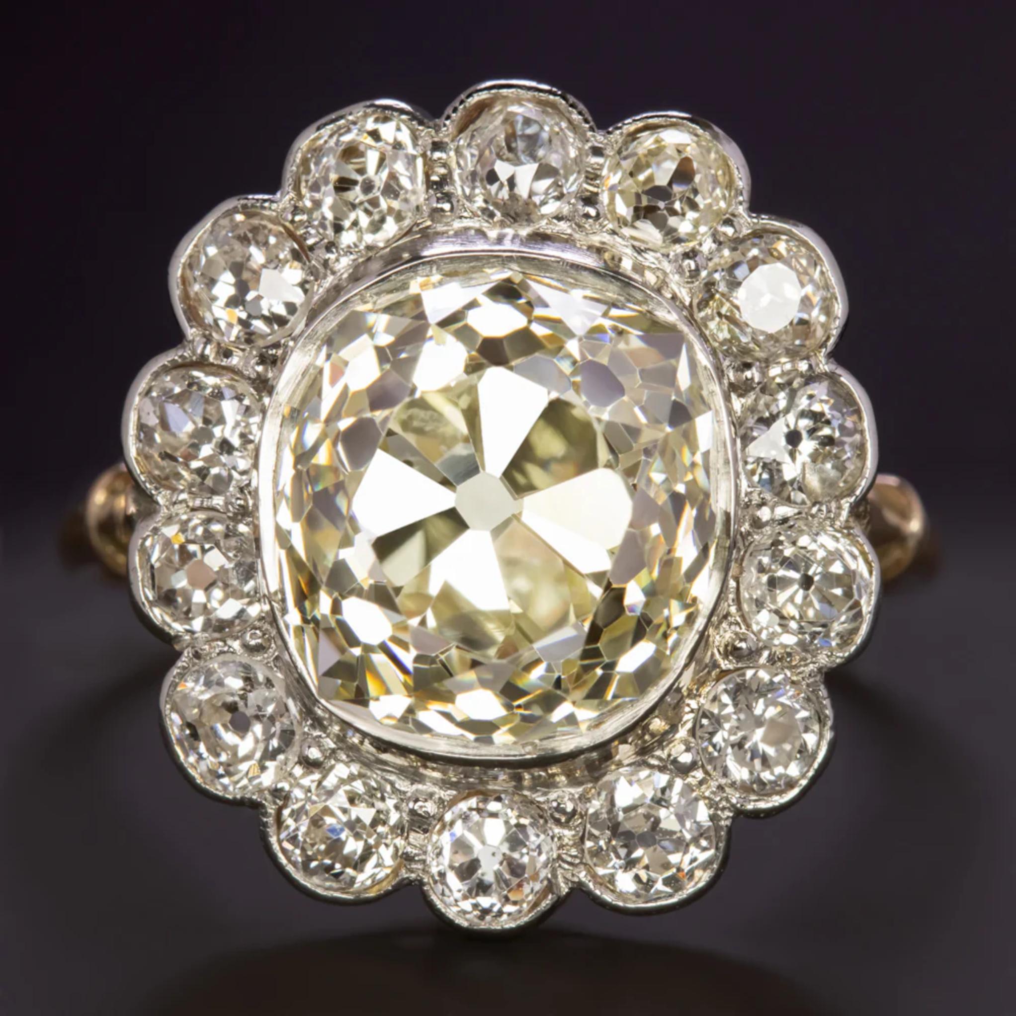 This glamorous vintage diamond ring has an absolutely jaw-dropping large look with a huge 6.28ct old mine cut diamond center surrounded by a chunky old cut diamond halo! It is an absolutely stunning rare find!

Highlights:

- Original vintage

-