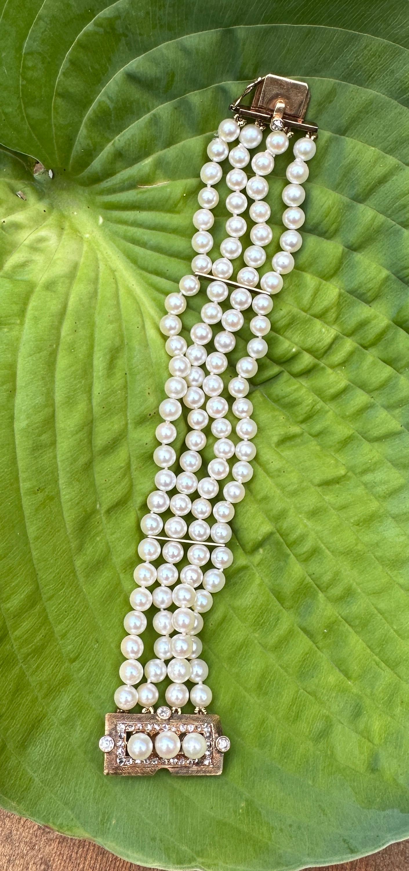 This is a spectacular antique Victorian - Art Deco Diamond and Pearl Multi-strand Bracelet of Museum Quality.  The Bracelet is set with four gorgeous Old Mine Cut Diamonds in the clasp.  These Old Mine Cut Diamonds are fabulous chunky diamonds that