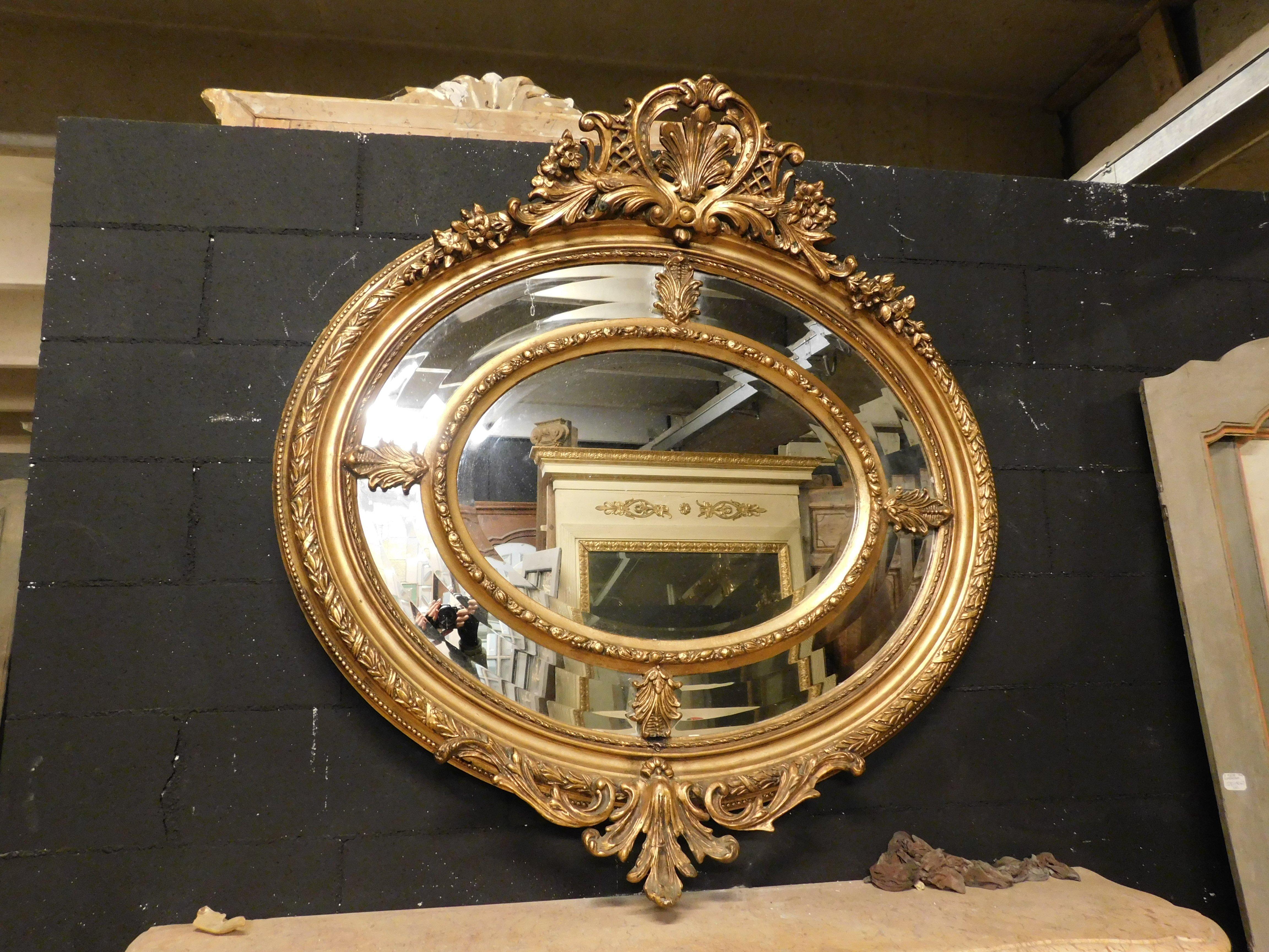 French Old mirror in gilded and richly carved wood, France For Sale