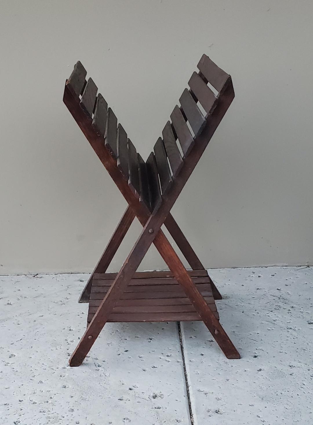 This Is An Old Oak Craftsman Magazine Rack Or Book Stand From The 1920s  With A Bottom Platform Or Shelf.
Beautiful Oak Wooden Book Stand Or Magazine Rack  Has A Dark Stain. 
This Book Stand Or Magazine Rack Stands Upright And Does Not Fold Or