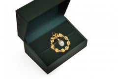 Old oak leaves brooch-pendant with pearls and diamonds from around 1900.