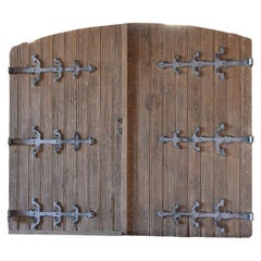 Old oak wooden gate with wrought-iron hinges 19th Century