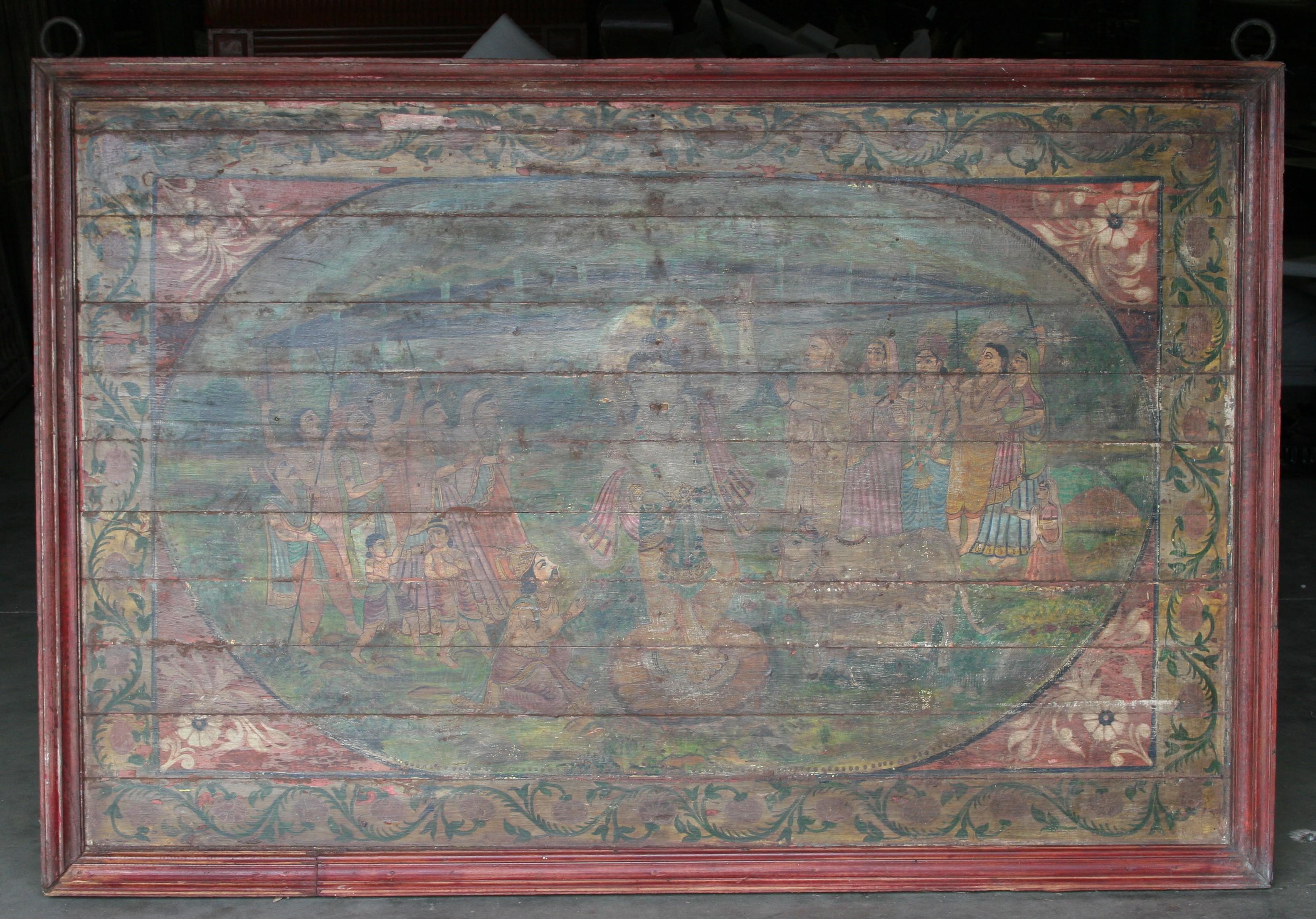 Years of black smoke from the oil lamps used in the temple darkened the surface of the painting. The two hand forged iron rings used for hanging the painting can be seen on either end. The painting depicts an important scene from the Hindu epic