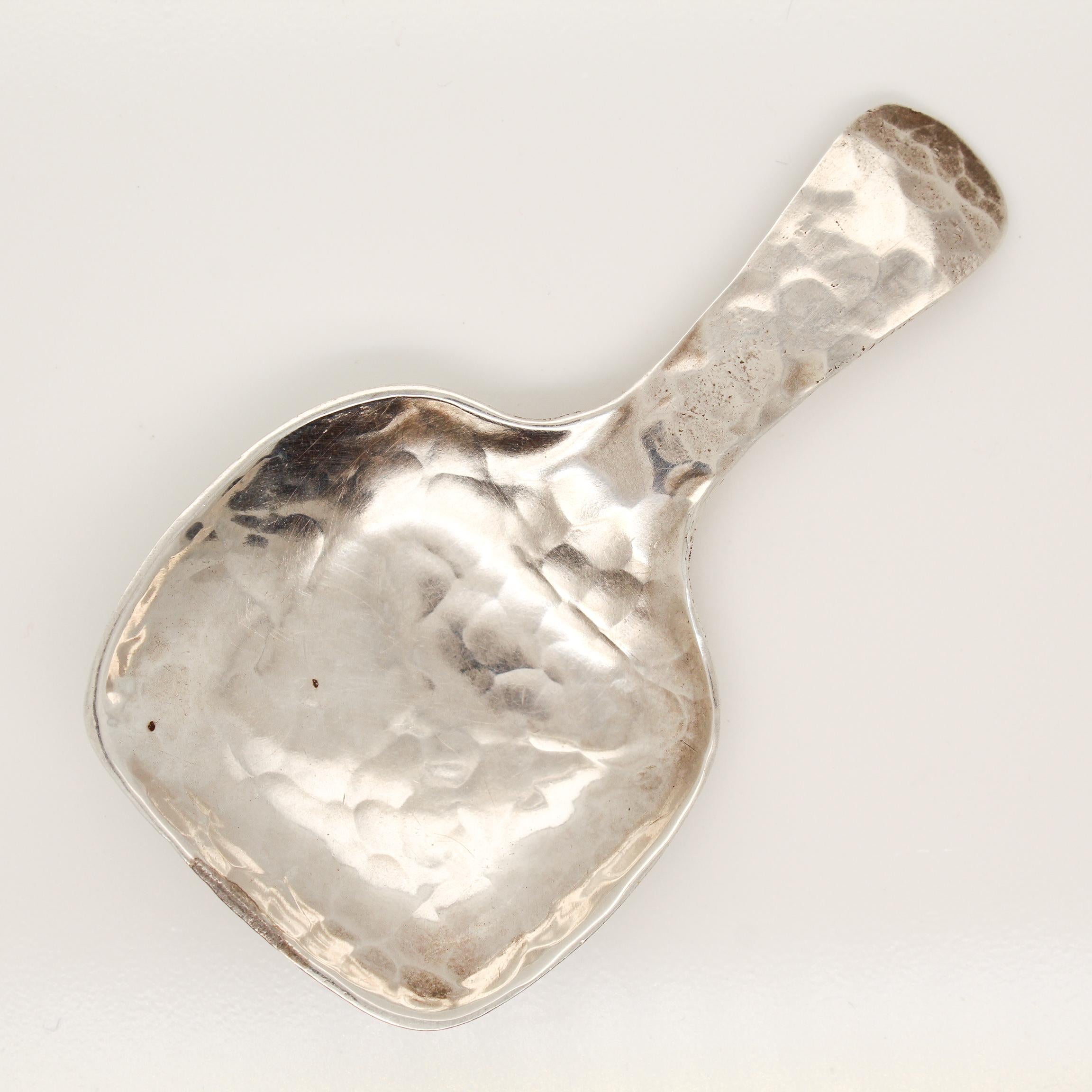 A fine antique sterling silver tea caddy spoon.

Textured throughout with hand hammering.

Simply a great Arts & Crafts design Tea accessory!

Date:
20th Century

Overall Condition:
It is in overall good, as-pictured, used estate