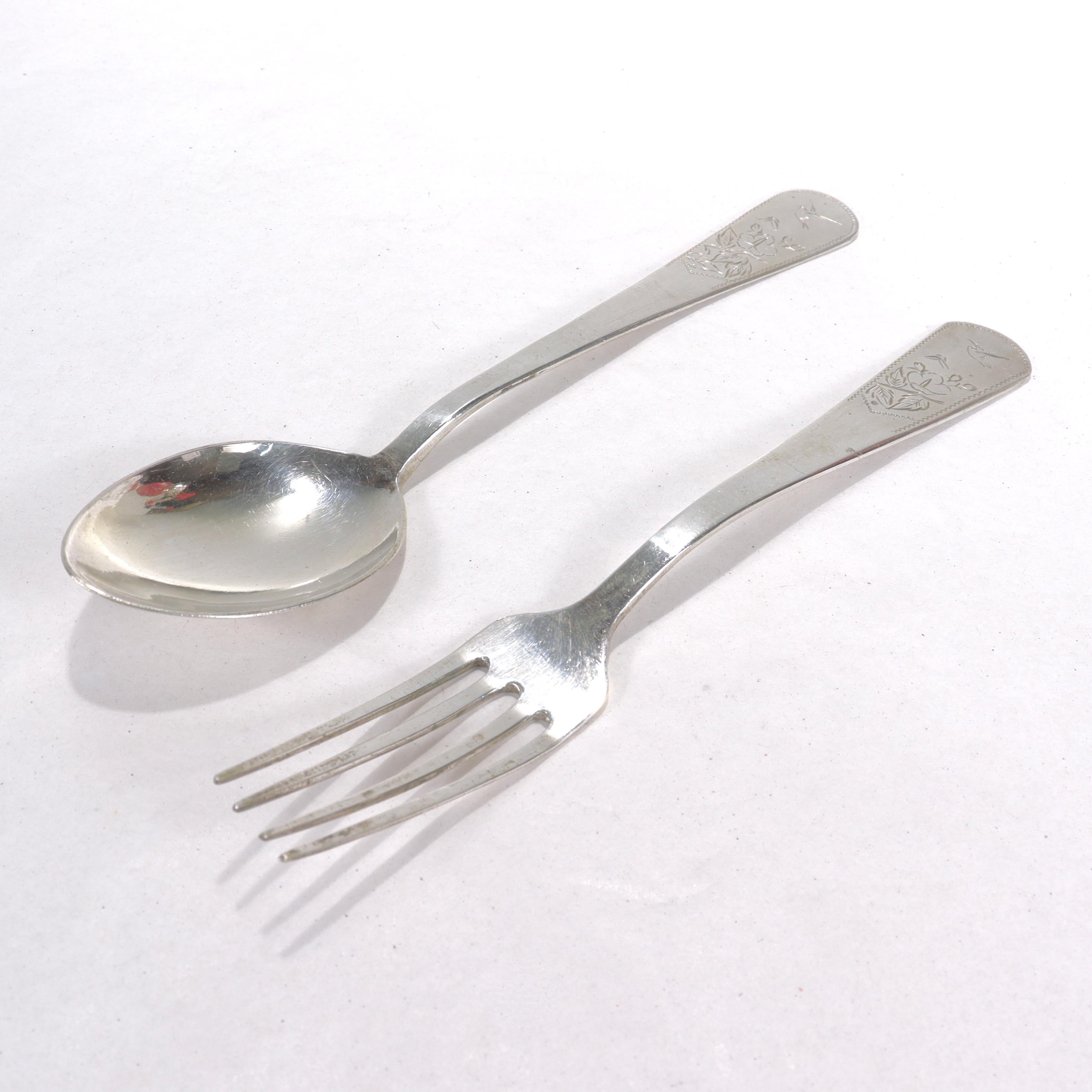 A fine Chinese export silver fork & spoon.

Each with flowers and birds engraved to the front of the handle.

The spoon is engraved with 