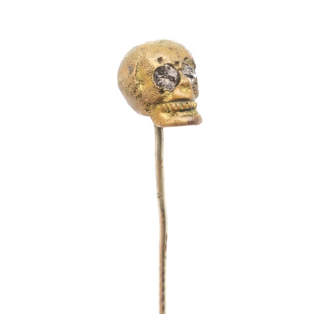 Edwardian Old or Antique Estate Bronze Skull Memento Mori Stick Pin with Glass Eyes For Sale