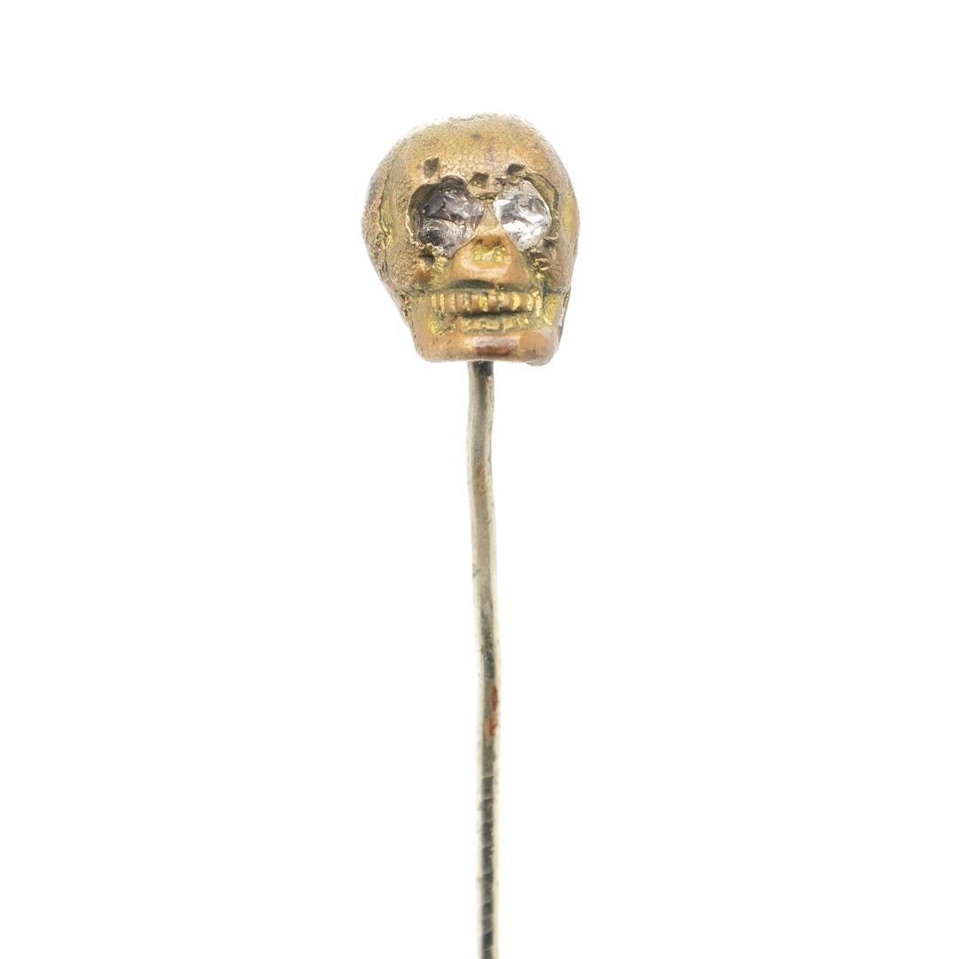 Women's or Men's Old or Antique Estate Bronze Skull Memento Mori Stick Pin with Glass Eyes For Sale