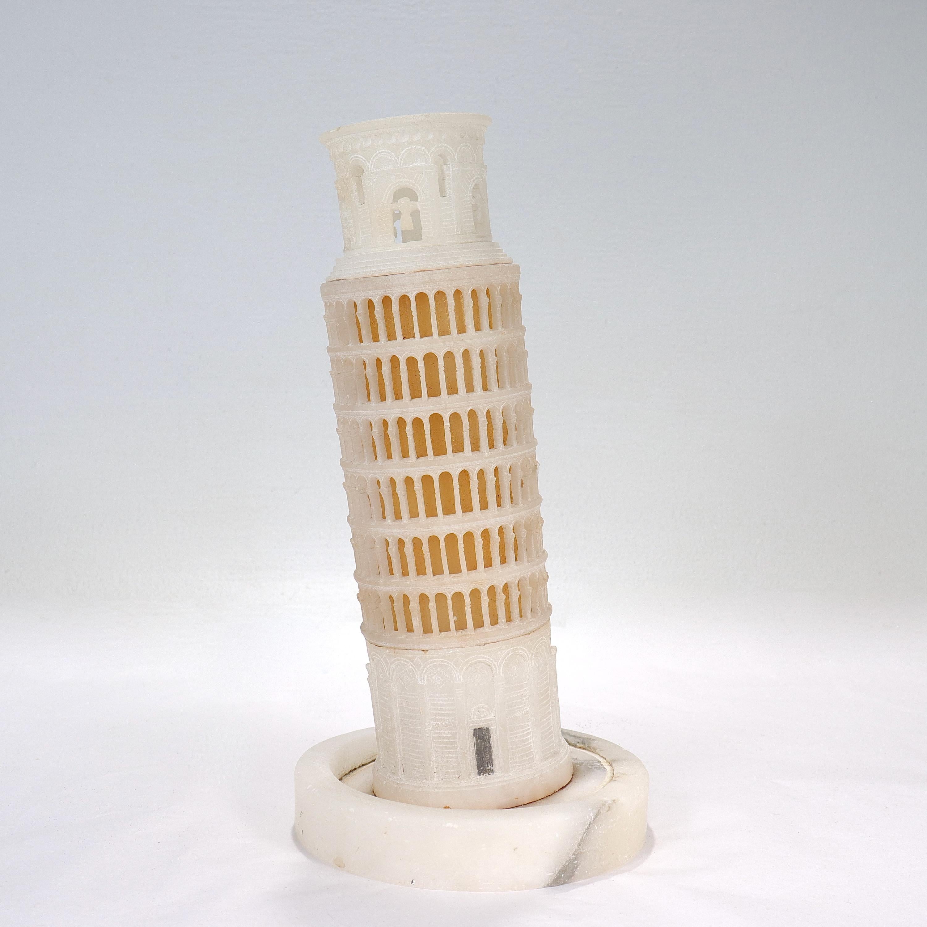 A fine Grand Tour style alabaster sculpture.

In the form of the Leaning Tower of Pisa atop a circular plinth. 

Simply a great model of the Ancient World's Wonders!

Date:
20th Century or earlier

Overall Condition:
It is in overall fair,
