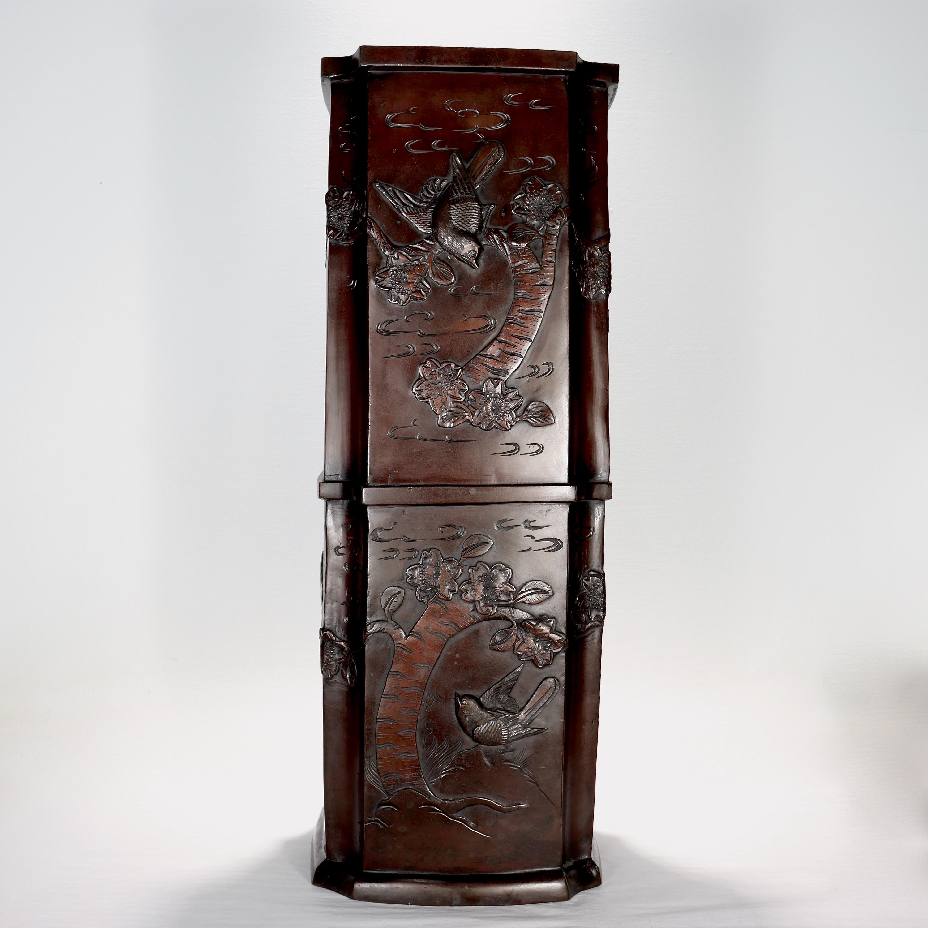 A fine old or antique Japanese bronze umbrella stand.

Decorated throughout with raised birds & flowers among a background of minimalist clouds.

With a warm chocolate brown patina (and lighter accents in the clouds).

Simply a great Japanese