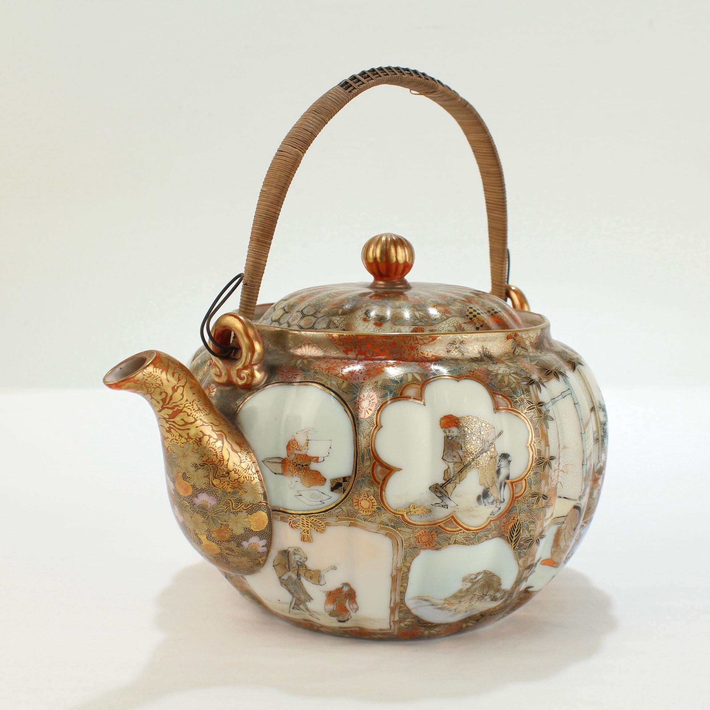 A fine antique Japanese Kutani porcelain teapot. 

With Satsuma style hand painted decoration throughout.

Having very finely hand painted botanical and bamboo decoration and cartouches with various scenes around the body and lid, a wire and