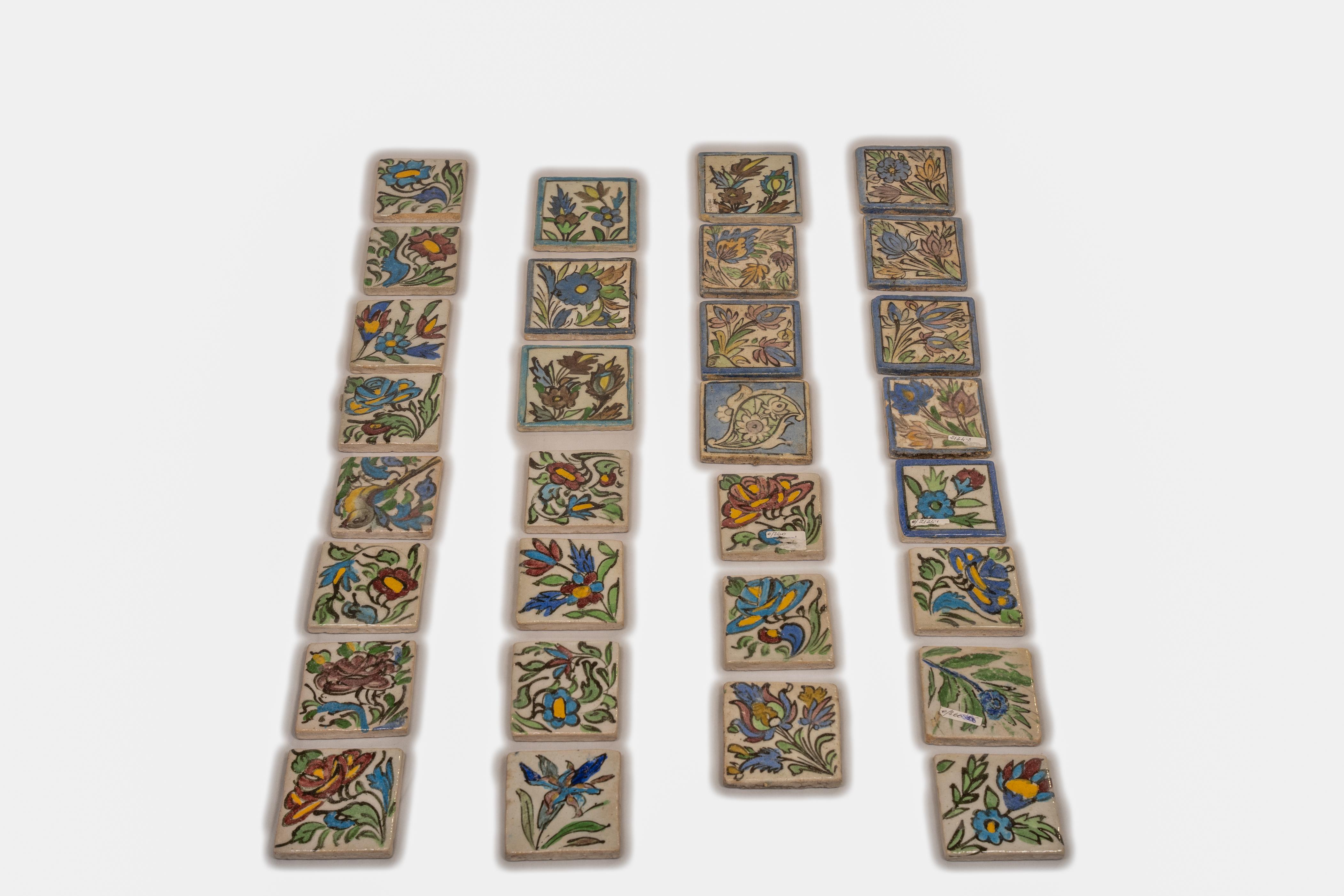 Series of small antique Persian tiles, hand painted, to be used perhaps as a border on a simple white wall.
There are other bigger ones, not yet photographed.
Think about how to use them: I used on the garden wall, but also for a kitchen.
Their