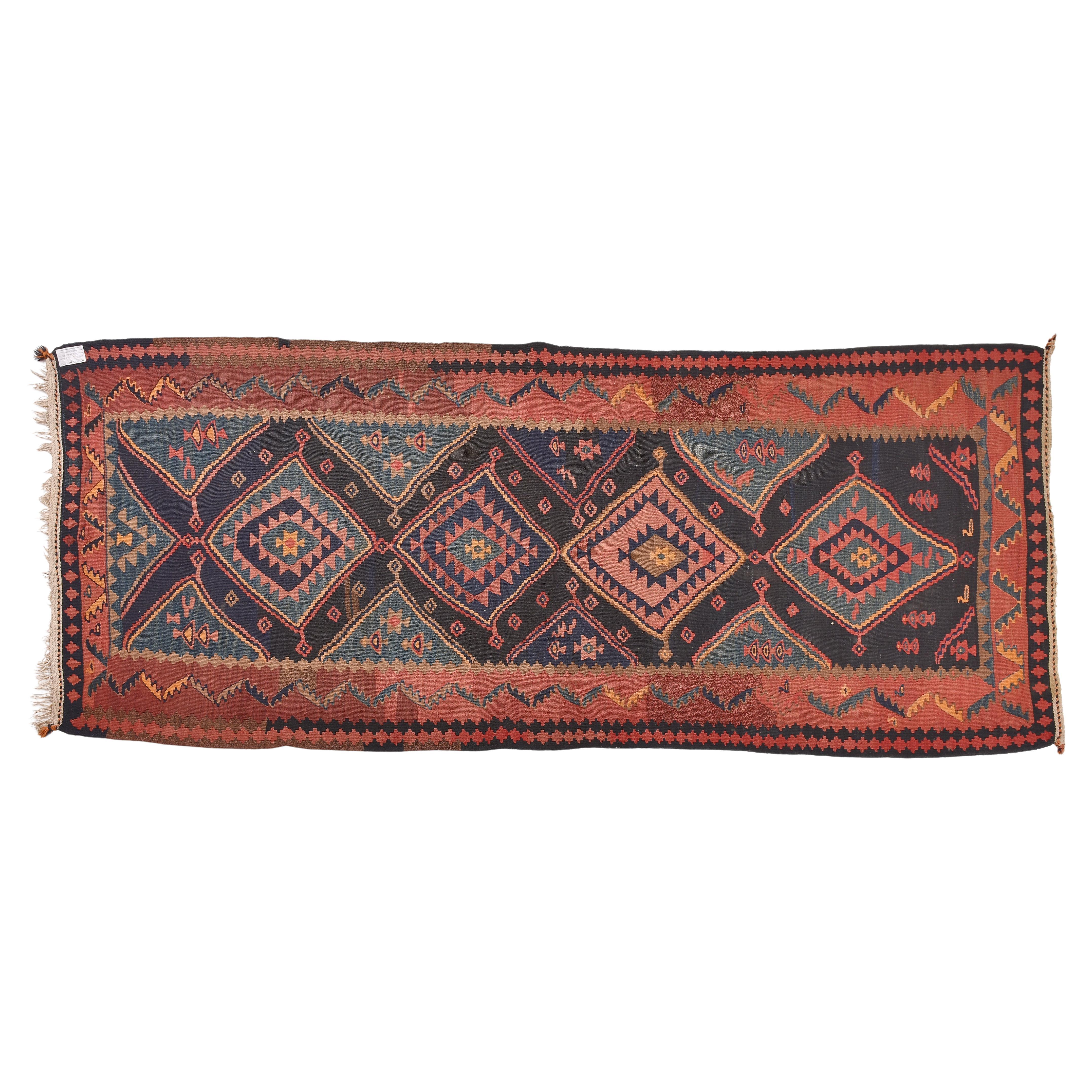nr. 304 -  Old Kurdish kilim with a strong personality, accentuated by karge geometric medallions and bold shades of blue.
Certainly created in a land blinded by the sun.
With an interestinf price for closing activities.