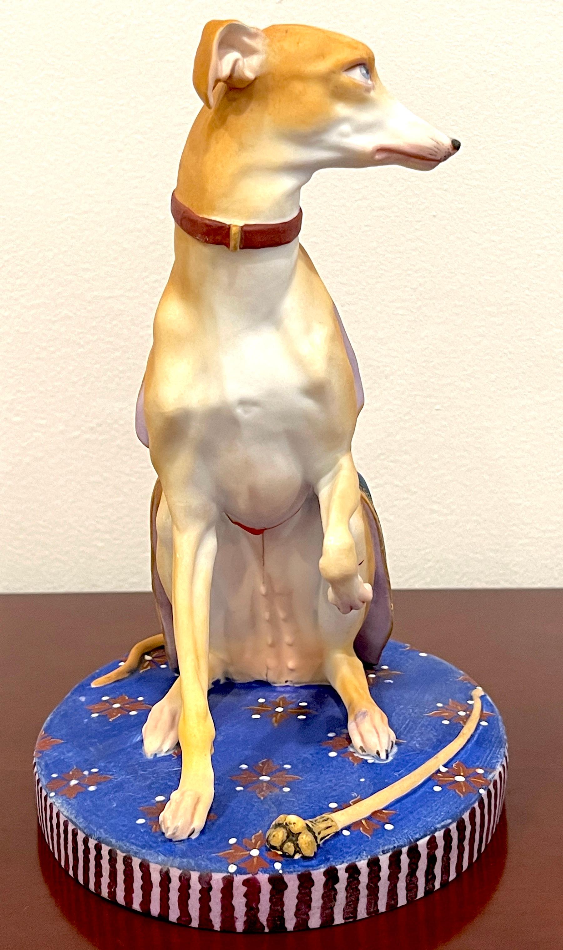 19th Century Old Paris Polychromed Biscuit Porcelain Model of Seated Draped Armorial Whippet 