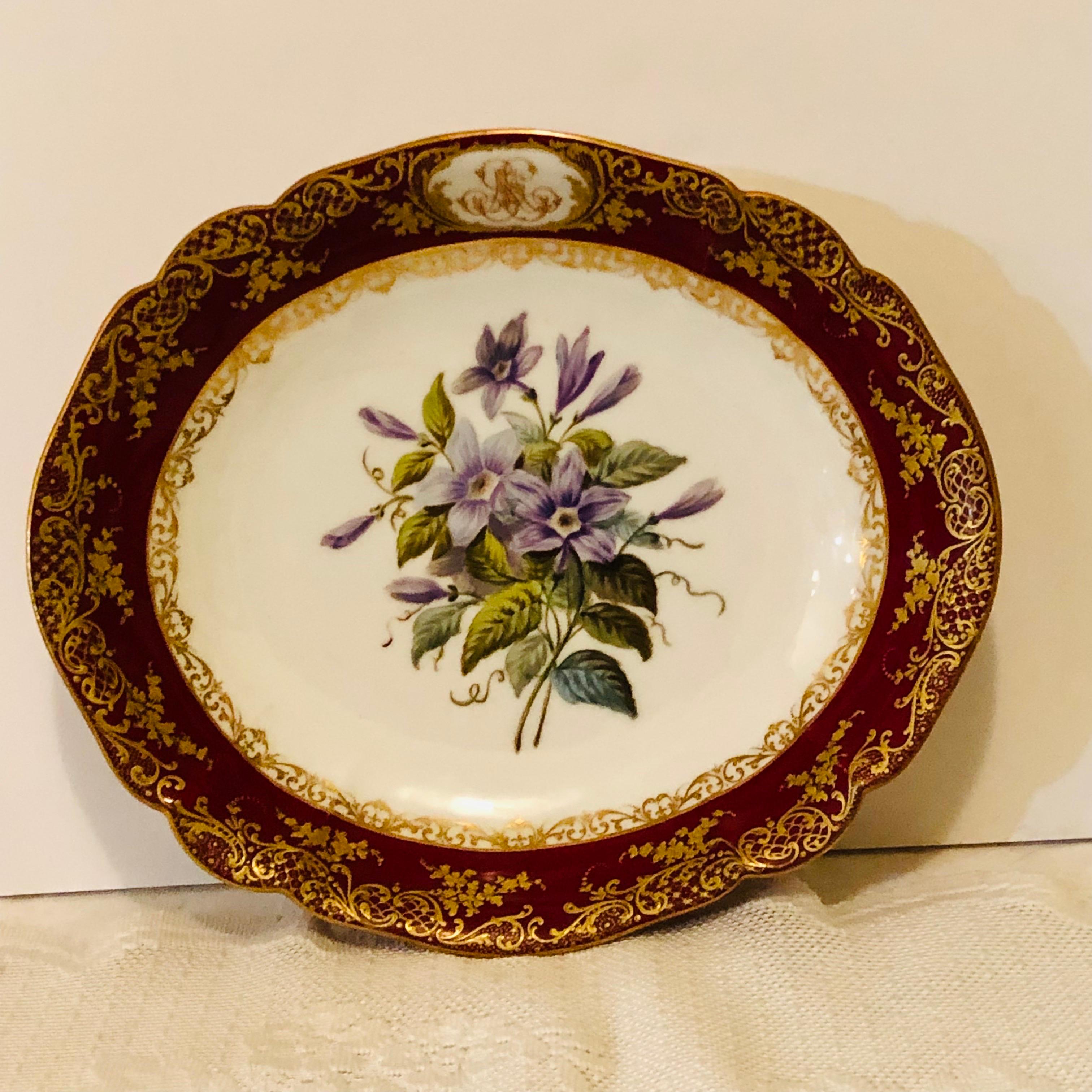 Look at the museum quality painting of clematis on this Old Paris Porcelain bowl painted by the studio of Boyer Rue De La Paix. This bowl was made in the mid 19th century. The central painting of clematis is surrounded by a maroon, red fluted border