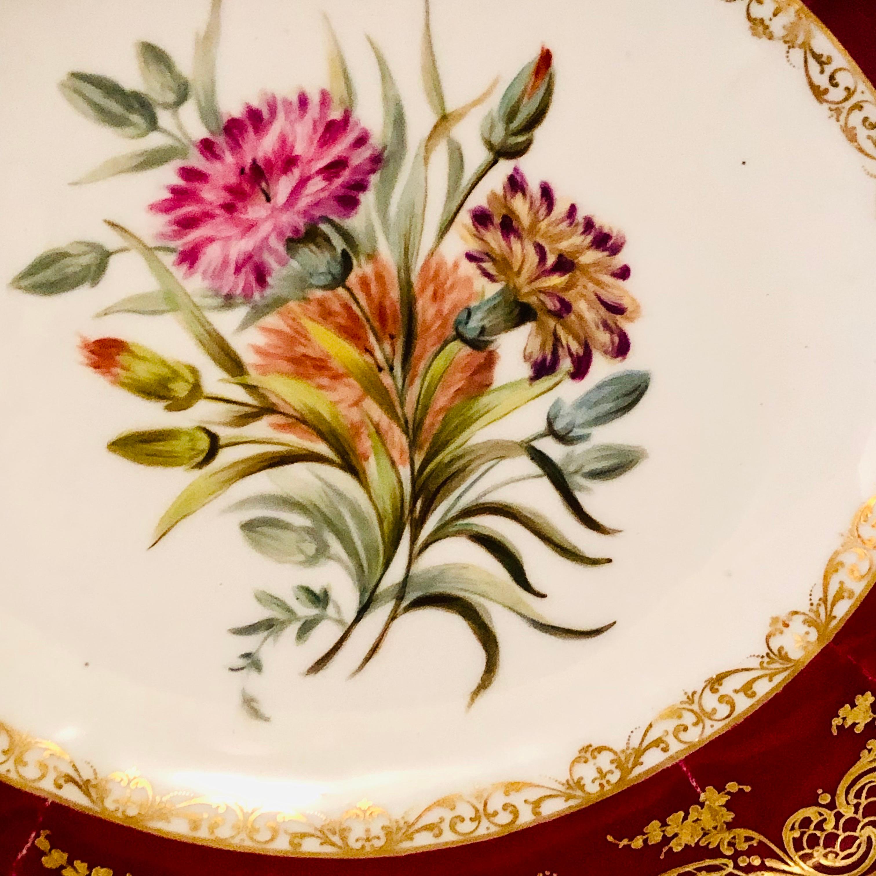 Look at the museum quality painting of carnations on this Old Paris Porcelain bowl painted by the studio of Boyer Rue De La Paix. This bowl was made in the mid 19th century. The central painting of carnations is surrounded by a maroon, red fluted