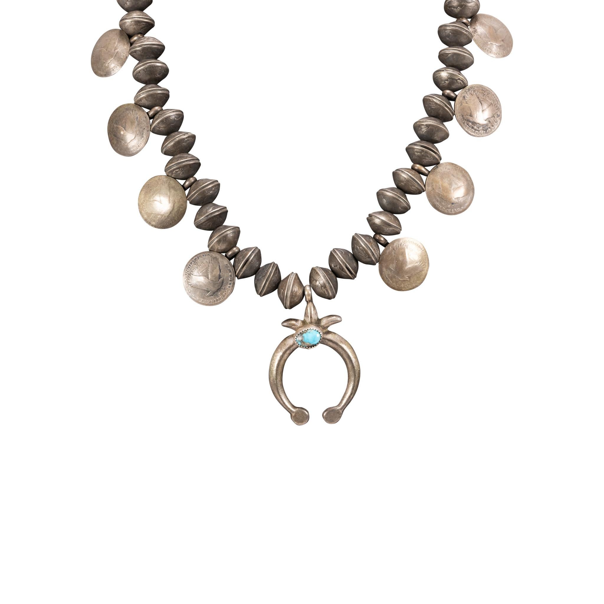 Native made coin squash blossom necklace. Single nugget of Red Mountain turquoise set in silver naja. Beads are made of liberty head dimes, having eight eagle quarters. Exceptional antique, great for display or for formal and casual Southwestern