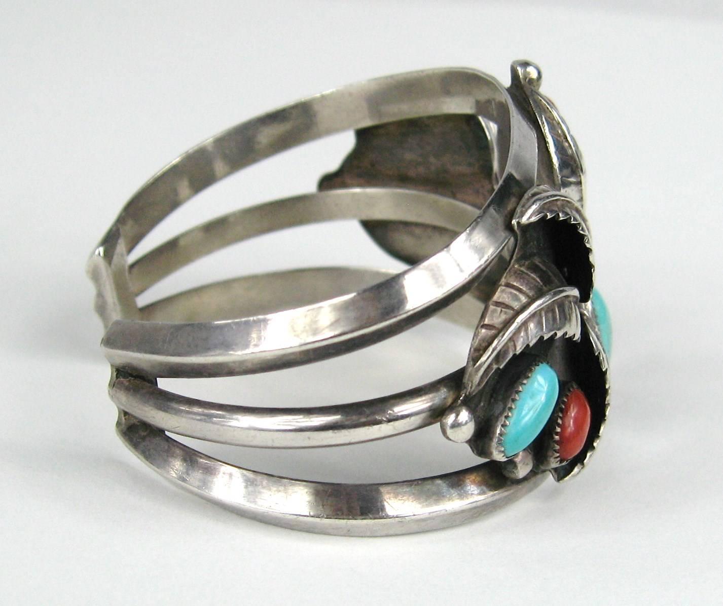 Stunning Old Pawn Sterling bracelet with both Turquoise and Coral bezel set in Sterling. 3 Feathered detailing on bracelet. Early Craftsmanship, simply stunning. Hallmarked Double Feather, early piece. Measuring 1.53