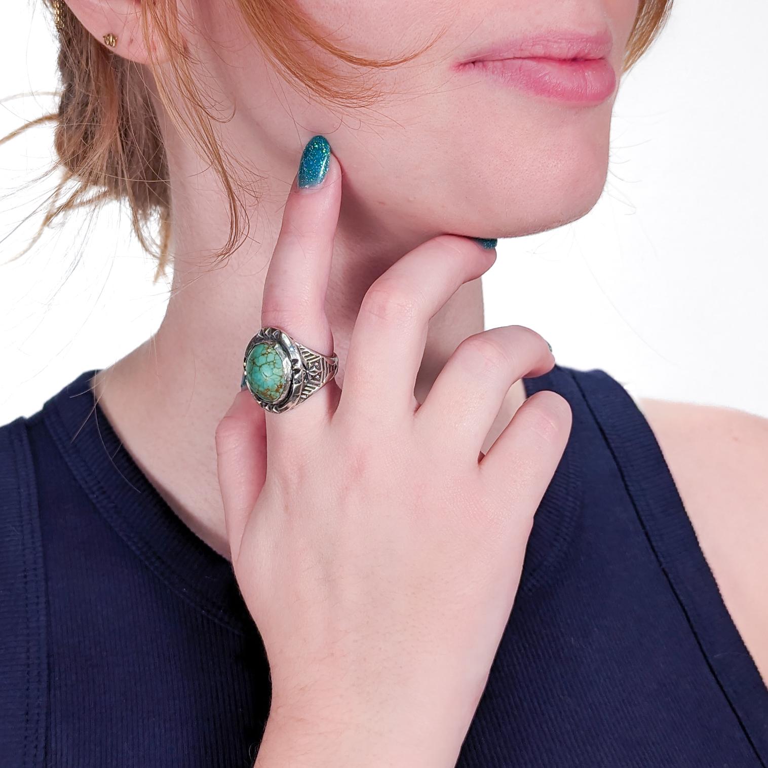 A fine vintage Navajo ring.

In silver and bezel set with a large oval turquoise cabochon.

Worked throughout with hand hammered decoration and liver sulfur patination to the recess.

Simply a fine Old Pawn ring!

Date:
20th Century

Overall