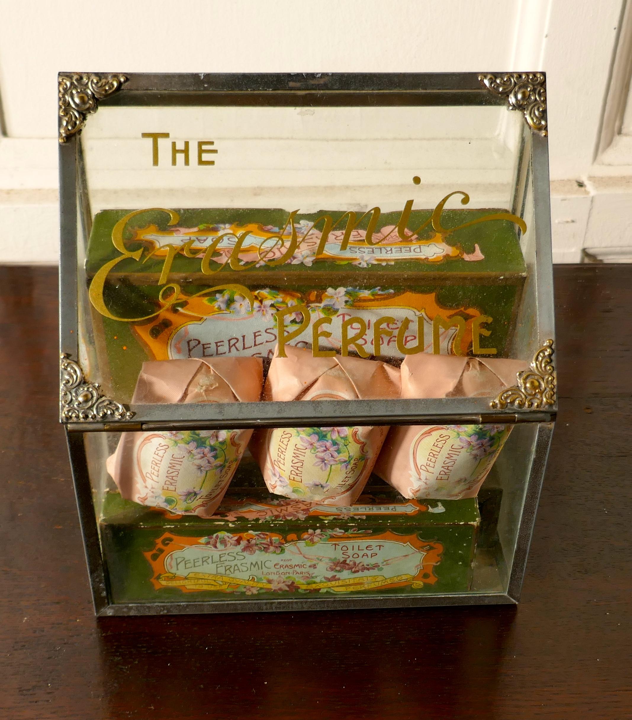 Old perfume, chemist shop display cabinet, Erasmic soaps and boxes

This charming little cabinet dates back to 1905, it is made in Glass and steel, it has decorative brass corners and “ THE ERASMIC PERFUME” in gold on the sloping top, the maker of
