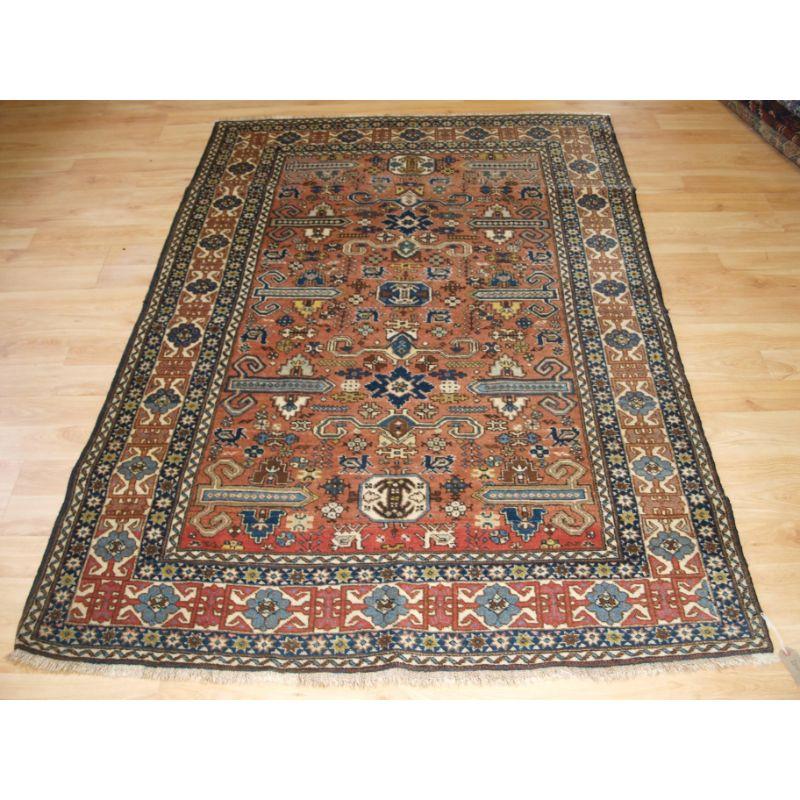 Old Persian Ardabil region rug with Caucasian Perepedil design on a soft red ground.

The rug is of classic design with an overall soft colour palette, this is a good strong furnishing rug.

The rug is in excellent condition with slight wear and