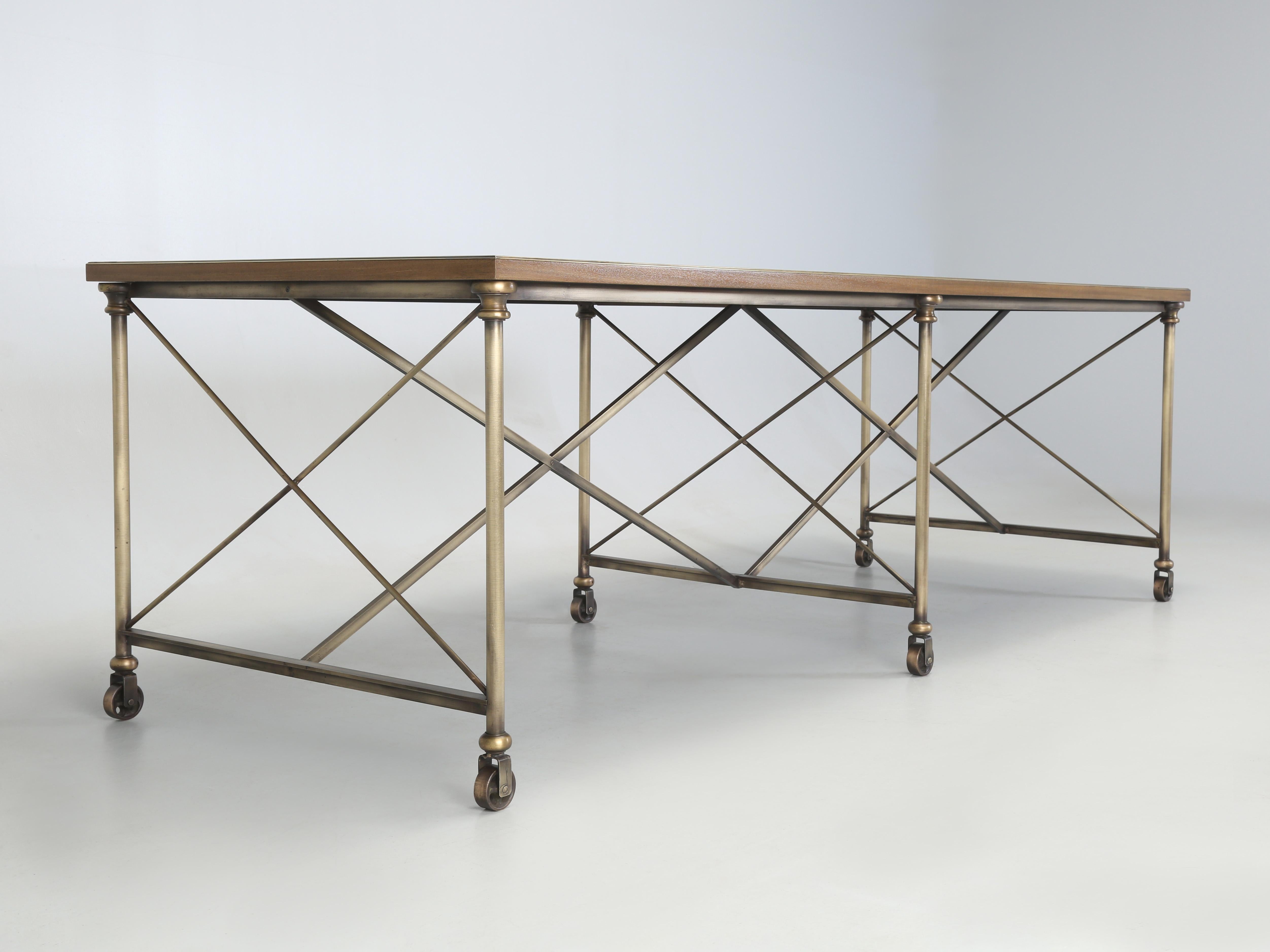 The Old Plank Exclusive Dining Table was fabricated from solid Bronze, imported French brass trim, walnut and mahogany. This exquisite French Industrial Inspired Dining Table is in stock for immediate delivery, or we can construct a similar custom