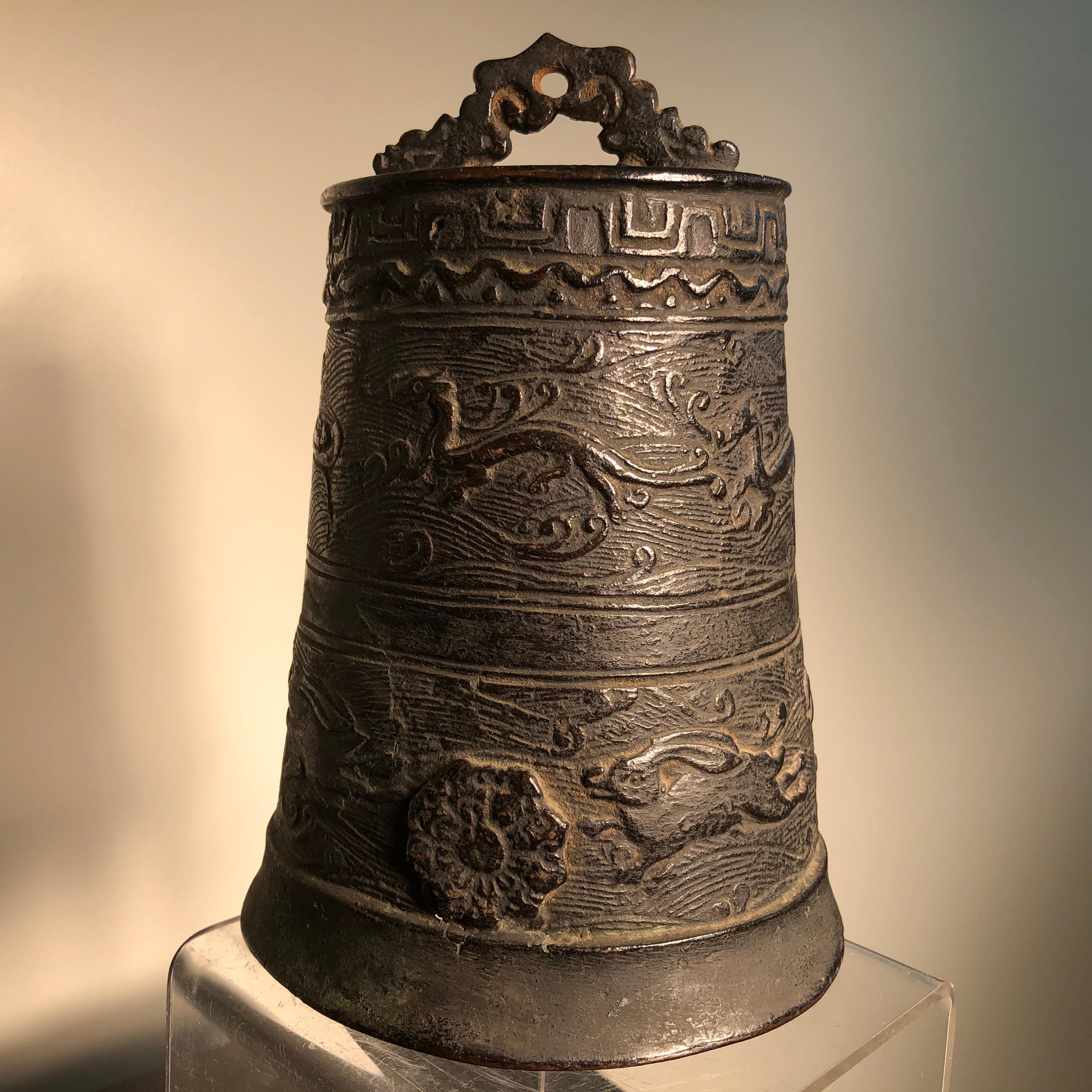 Here's a beautiful and unique way to accent your indoor or outdoor garden space with this treasure from Japan! 

This is a solid bronze casting of a temple bell Bonsho that features an unusual depiction of rabbits and dragons . This bell was