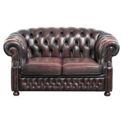 Old red/brown English cowhide leather Chesterfield 2-seater sofa