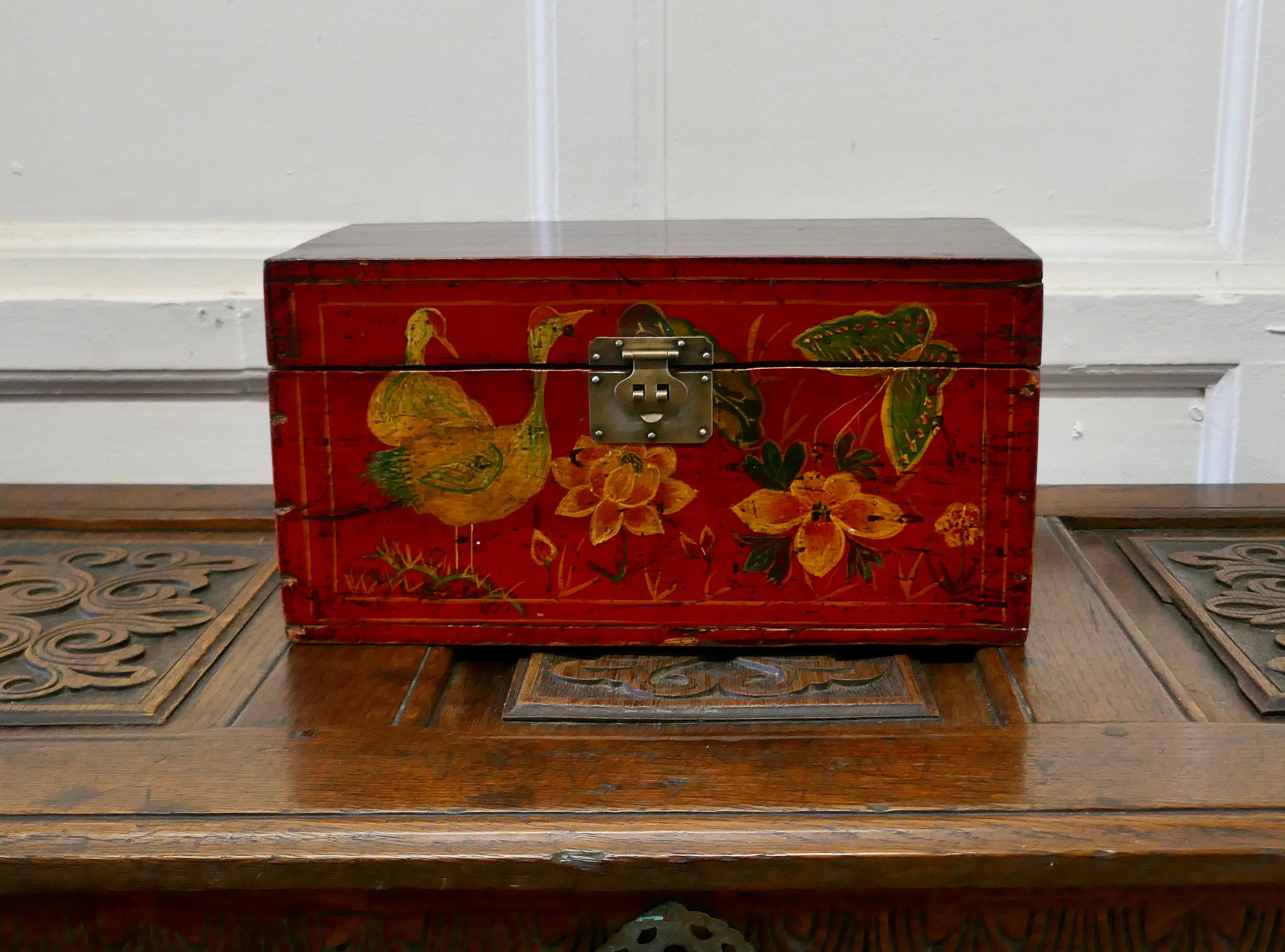Old Red Chinoiserie Lacquer box decorated with birds flowers and butterflies

The box is made in wood, it is decorated with birds flowers and butterflies, the Chinese symbols for happiness, there is a brass clasp to the front 

The box is in