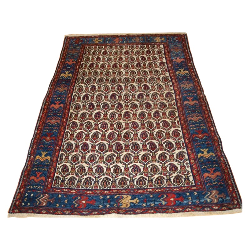 Tapis ancien provenant de la région du Grand Hamadan, en Extrême-Orient et en Perse du Nord-Ouest