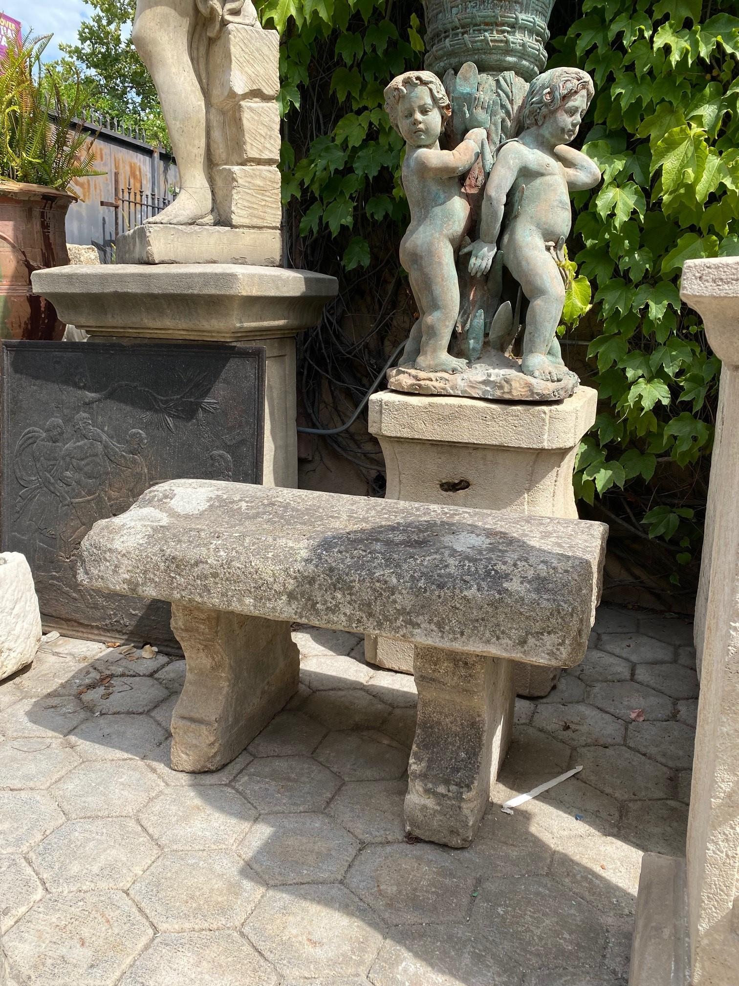 18th century hand carved stone bench. This rustic beauty is a rare piece indeed A beautiful garden bench simple lines that works in an interior as a seating or decorative architectural sculpted element. Mounted against a wall in a modern context