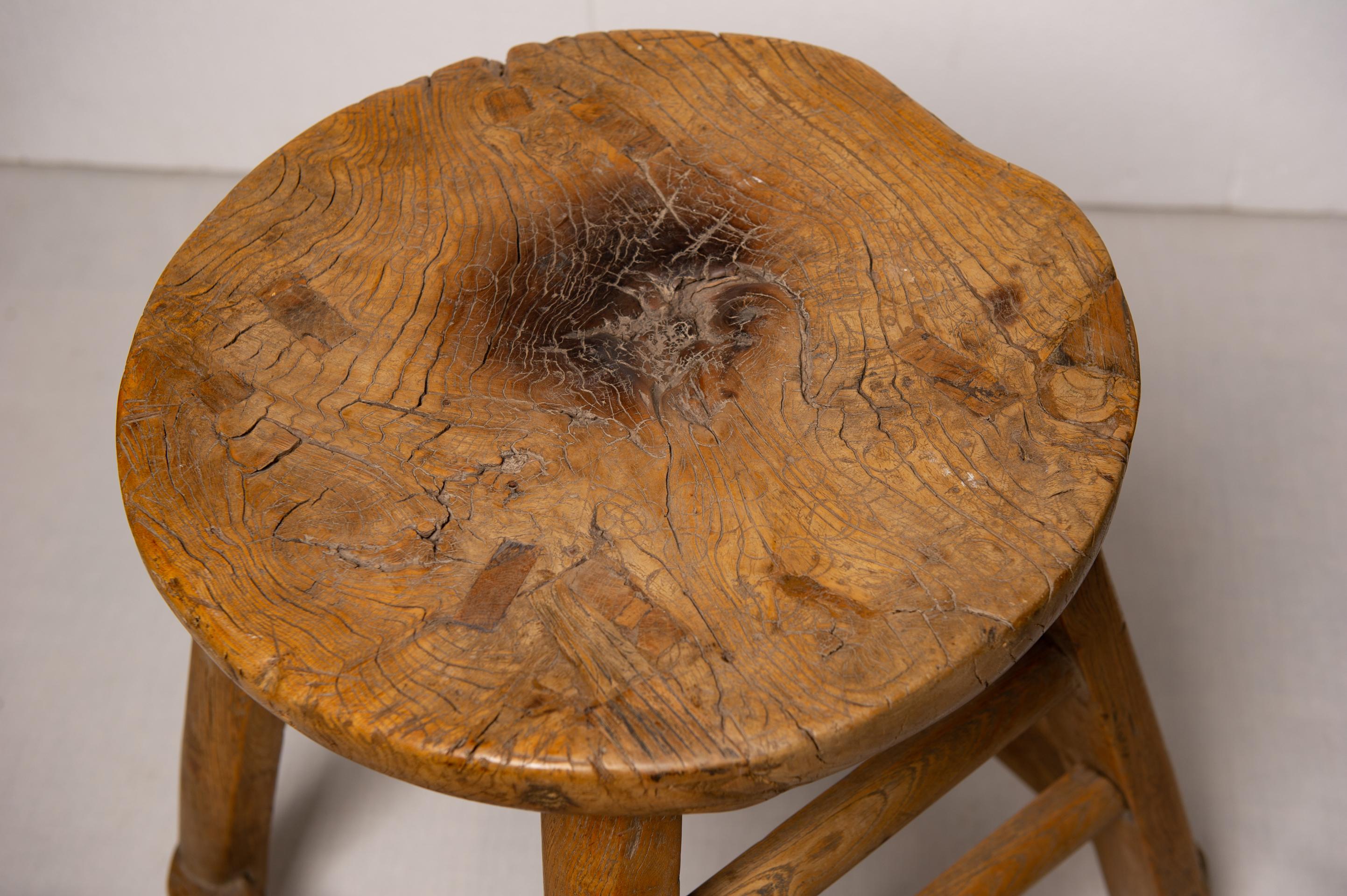 M/1322 - This rustic wooden stool is maybe an Italian farmer stool with a burn mark: perhaps a forgotten candle still burning. The hard wood prevented the whole stool from burning.  In Japanese language it's a perfect example of 