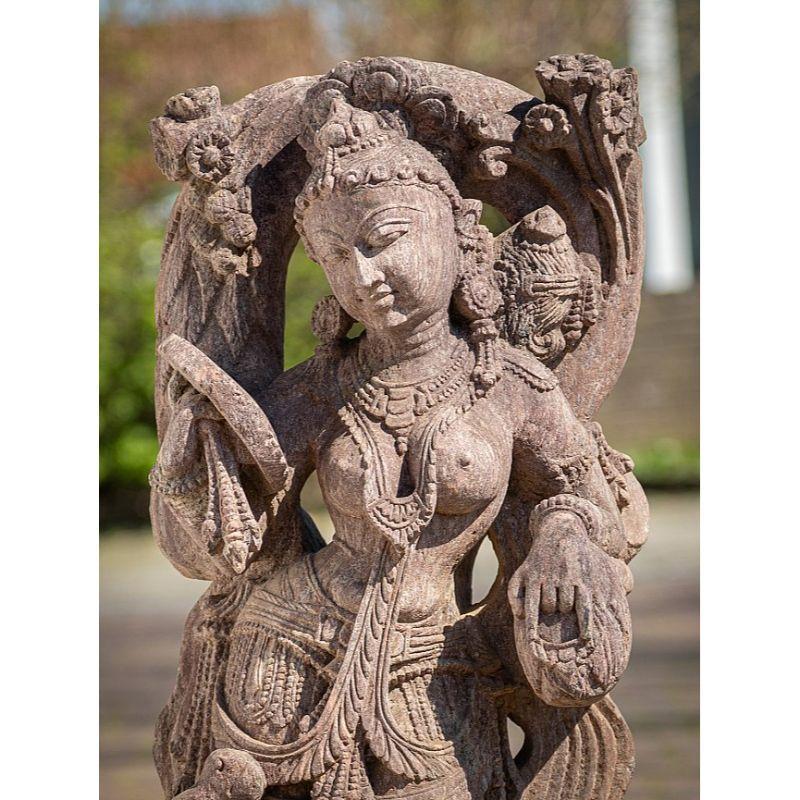 Material: Sandstone
Material: wood
93,5 cm high 
35,5 cm wide and 21 cm deep
Hand carved from a single block of sandstone
Originating from India
Middle 20th century
From the state of Odissa
Can be shipped worldwide.
 
