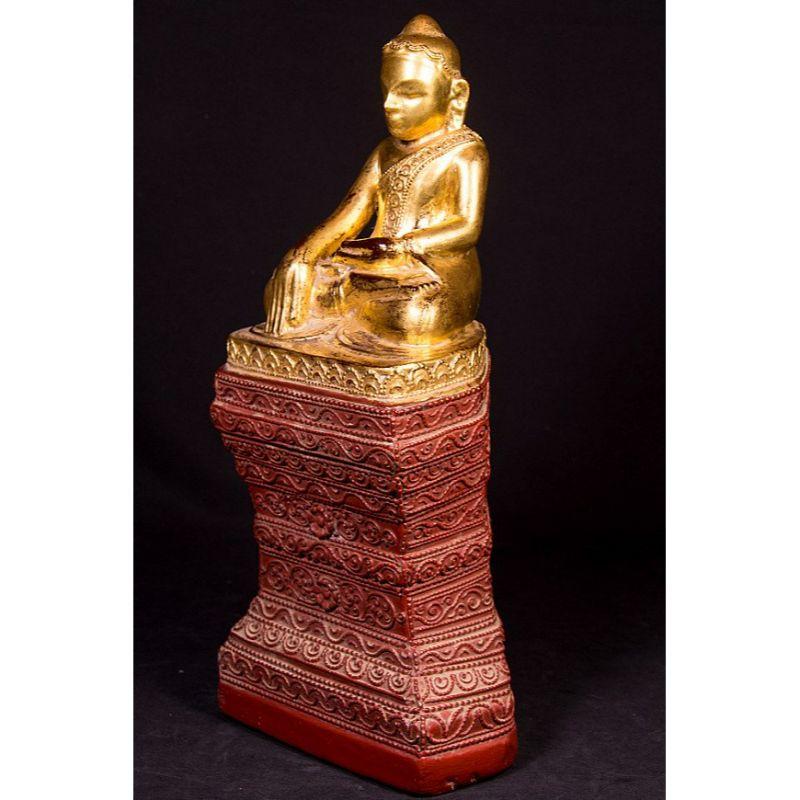 Material: Sandstone
Material: wood
42 cm high 
18,5 cm wide and 13 cm deep
Weight: 7.8 kgs
Gilded with 24 krt. gold
Ava style
Bhumisparsha mudra
Originating from Burma
Middle 20th century

 