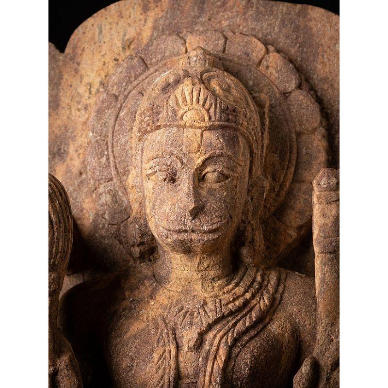 Material: Sandstone
Material: wood
50,5 cm high 
21,5 cm wide and 13,3 cm deep
Weight: 16 kgs
Originating from India
Middle 20th century
From the state Odissa in India
Can be shipped worldwide

