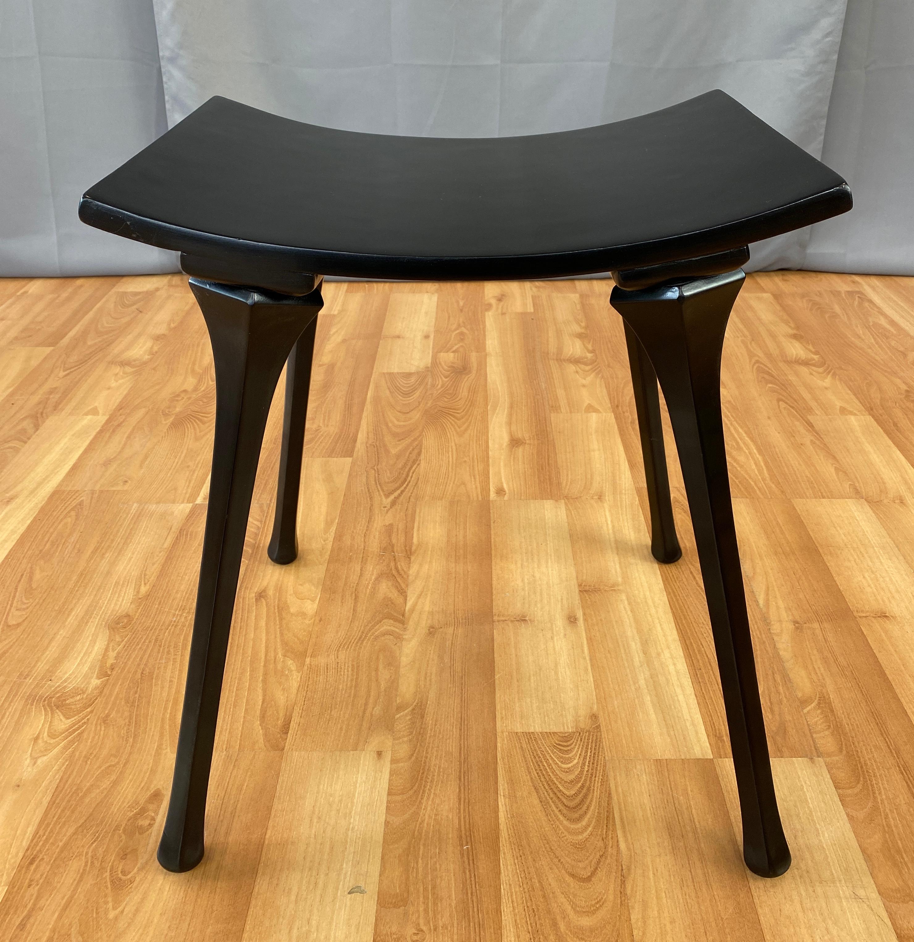 Offered here is a circa 1940s/50s Black wooded stool, simple in design, but giving you lots of glam. 
Nice curve seat, that holds you just right, held up by a set of four sexy four-sided legs. 
No maker markings found.