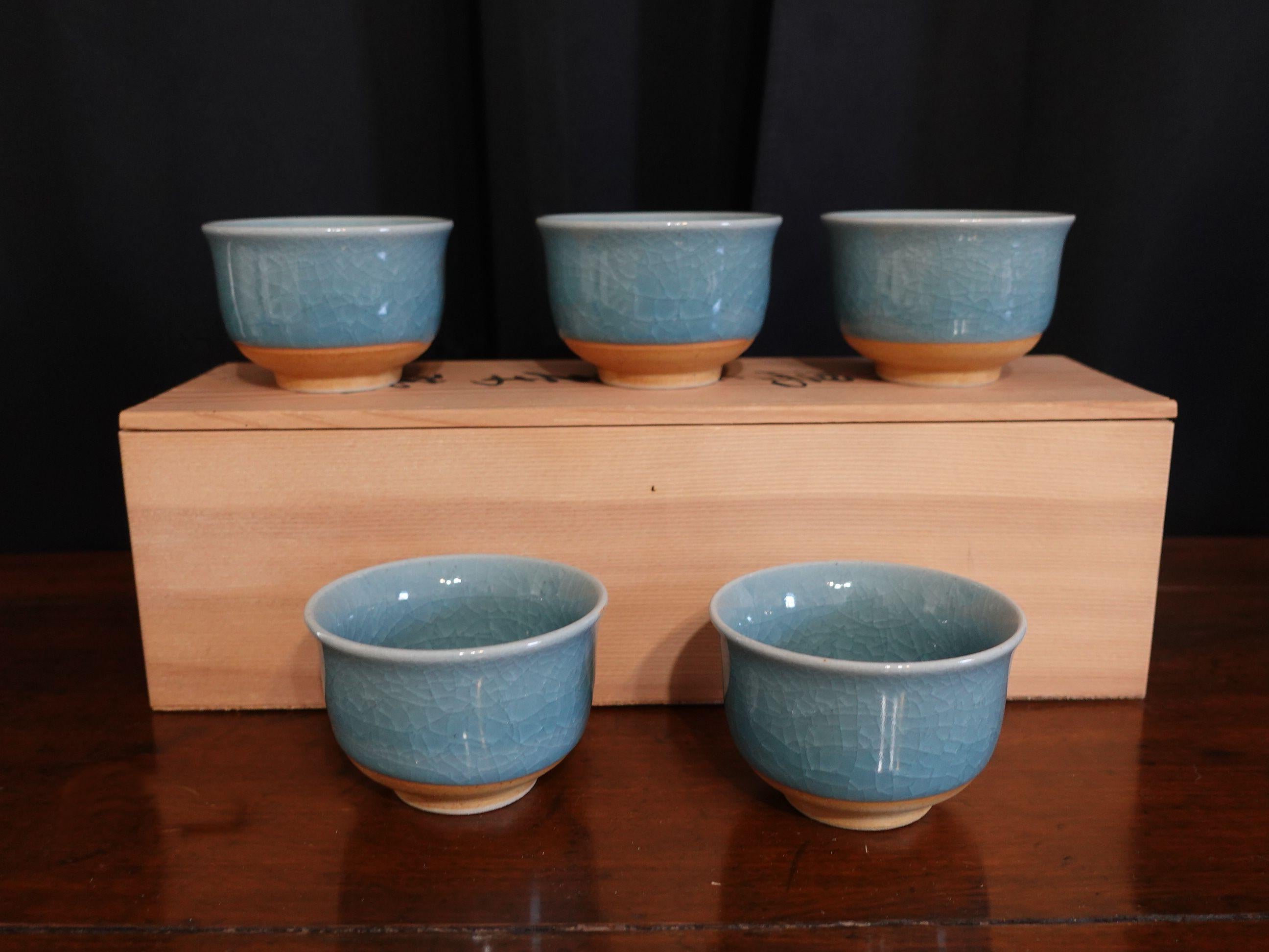 Old - Set of 5 Japanese Tajimi Teacups with light blue glazing.
Original box included with the seal

In good original new condition and just found in the warehouse, never used before.