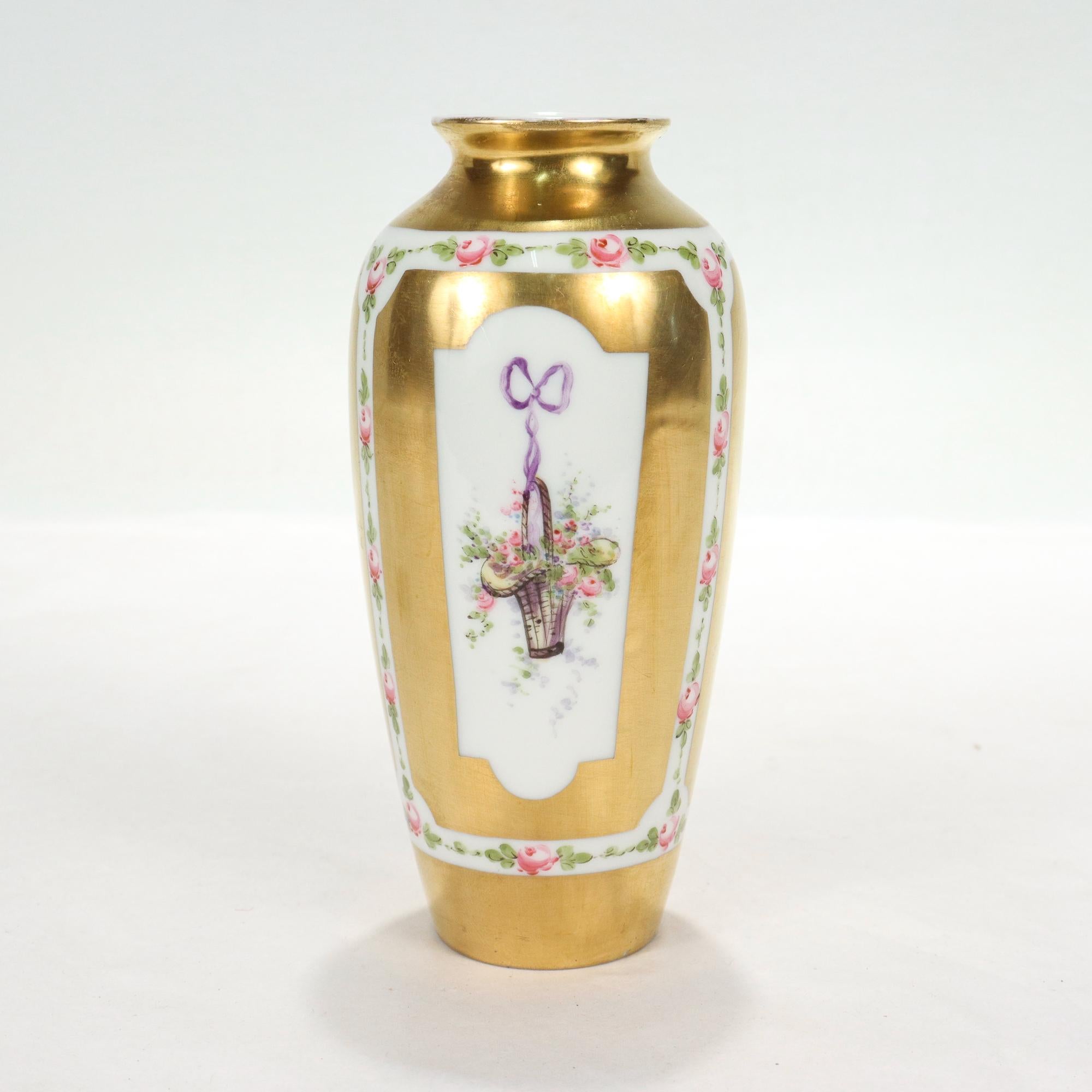 A fine old or antique Sevres type porcelain vase.

With rich gilding and handpainted flower baskets & ribbons throughout. 

Marked to the based with a blue Sevres type interlaced 