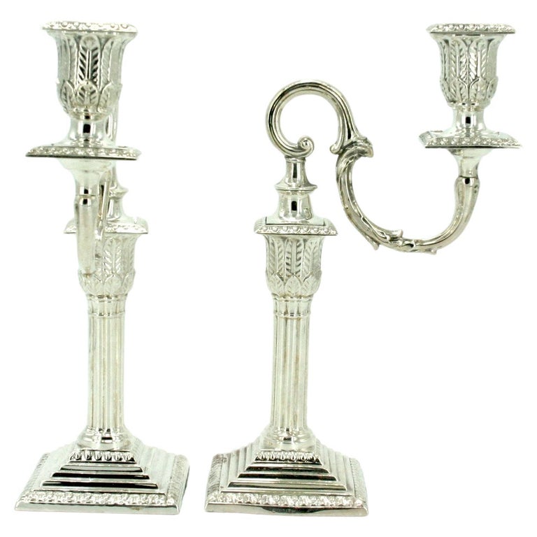 Old English sheffield silver plated pair of piano candle stick with exterior design details. Each candle stick is in great condition. Minor wear consistent with age / use. Each one measures 9.5 inches high X 5.5 inches wide .
 