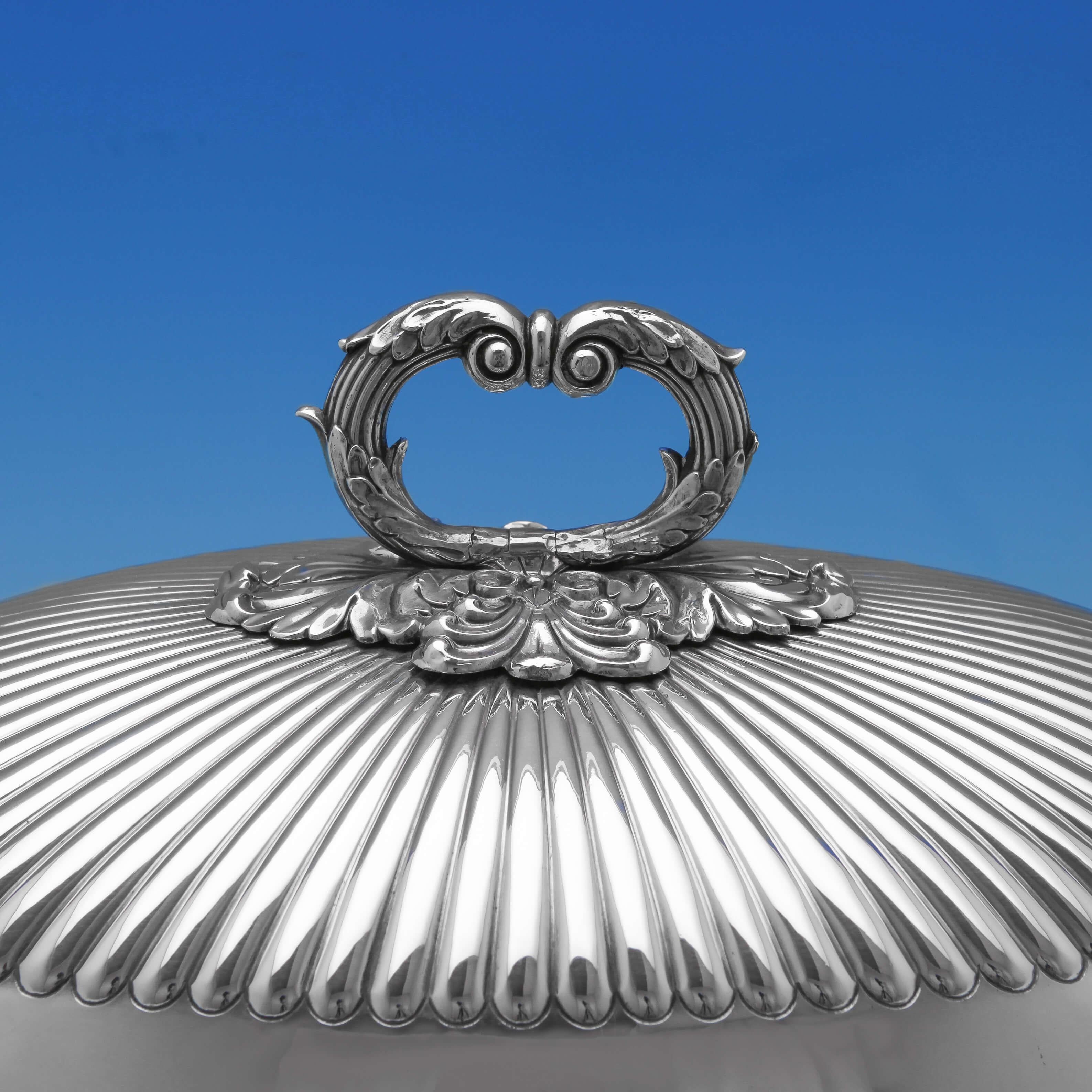Made circa 1830 by Matthew Boulton, this wonderful, William IV, Antique, Old Sheffield plated meat dish and cover, exemplifies fine craftsmanship, standing on lion paw feet and featuring shell and gadroon borders, acanthus scroll handles, fluting to