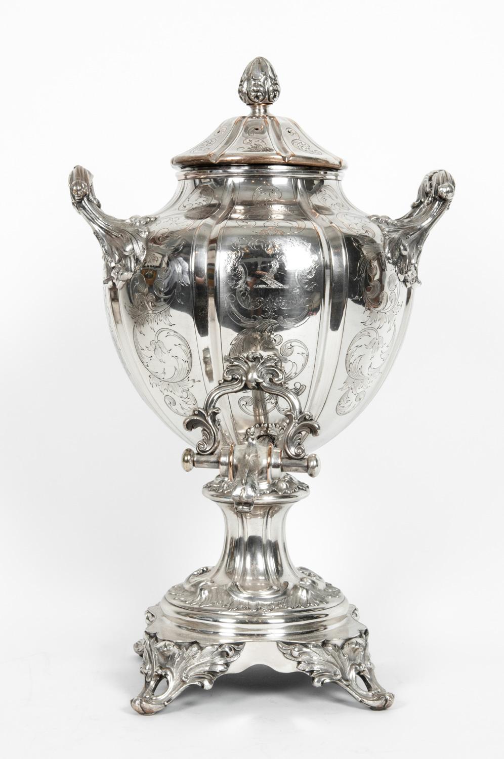 Antique English Regency Old Sheffield Samovar. It is silver plated on copper with beautiful embossed and engraved foliate and floral design details decoration. The piece is in excellent antique condition with minor wear consistent with age and use,