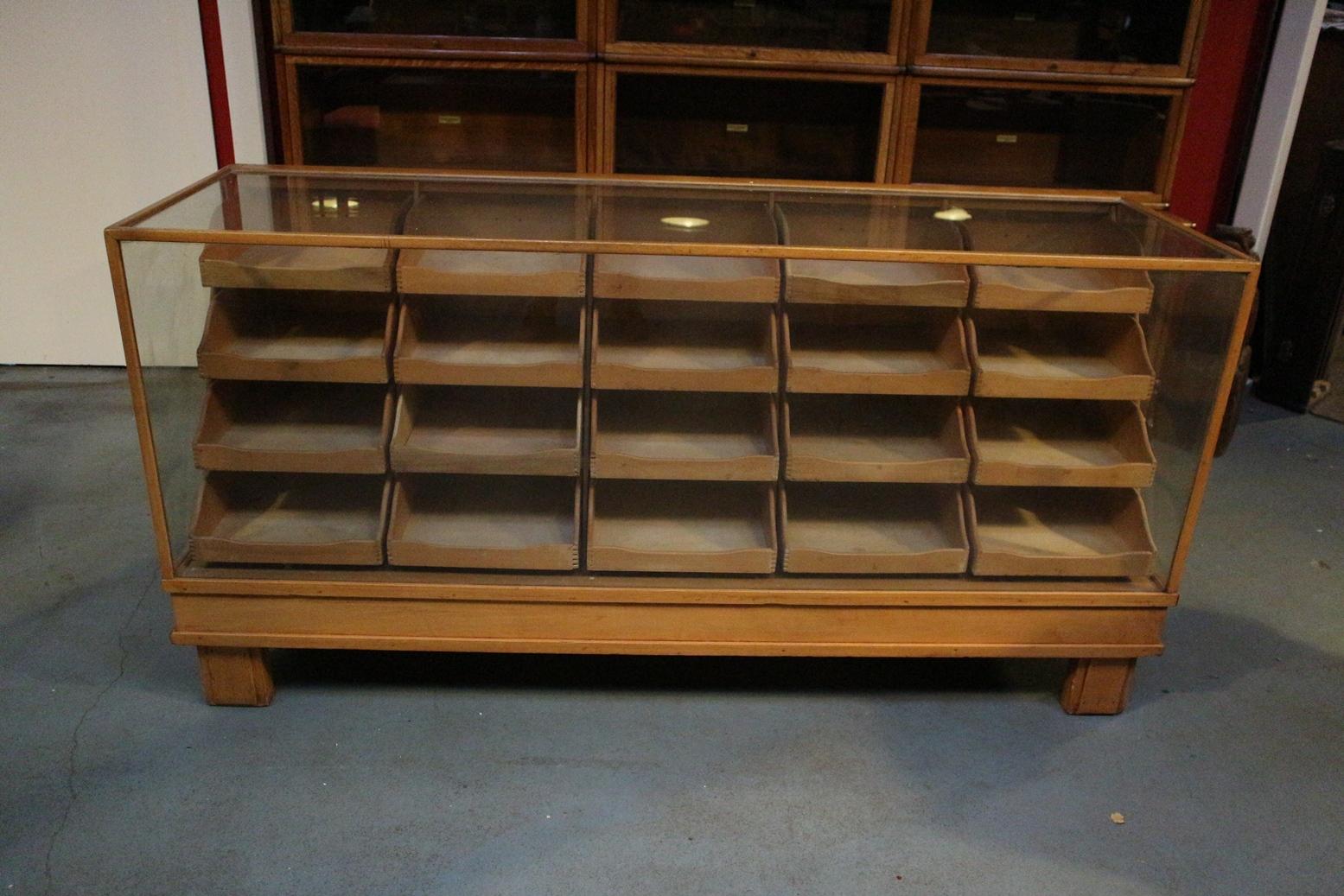 Old beech wood counter display case with 20 drawers. Counter is in good and original condition.
Origin: England
Period: circa 1920-1940
Size: 181cm x 48cm x h. 91cm.