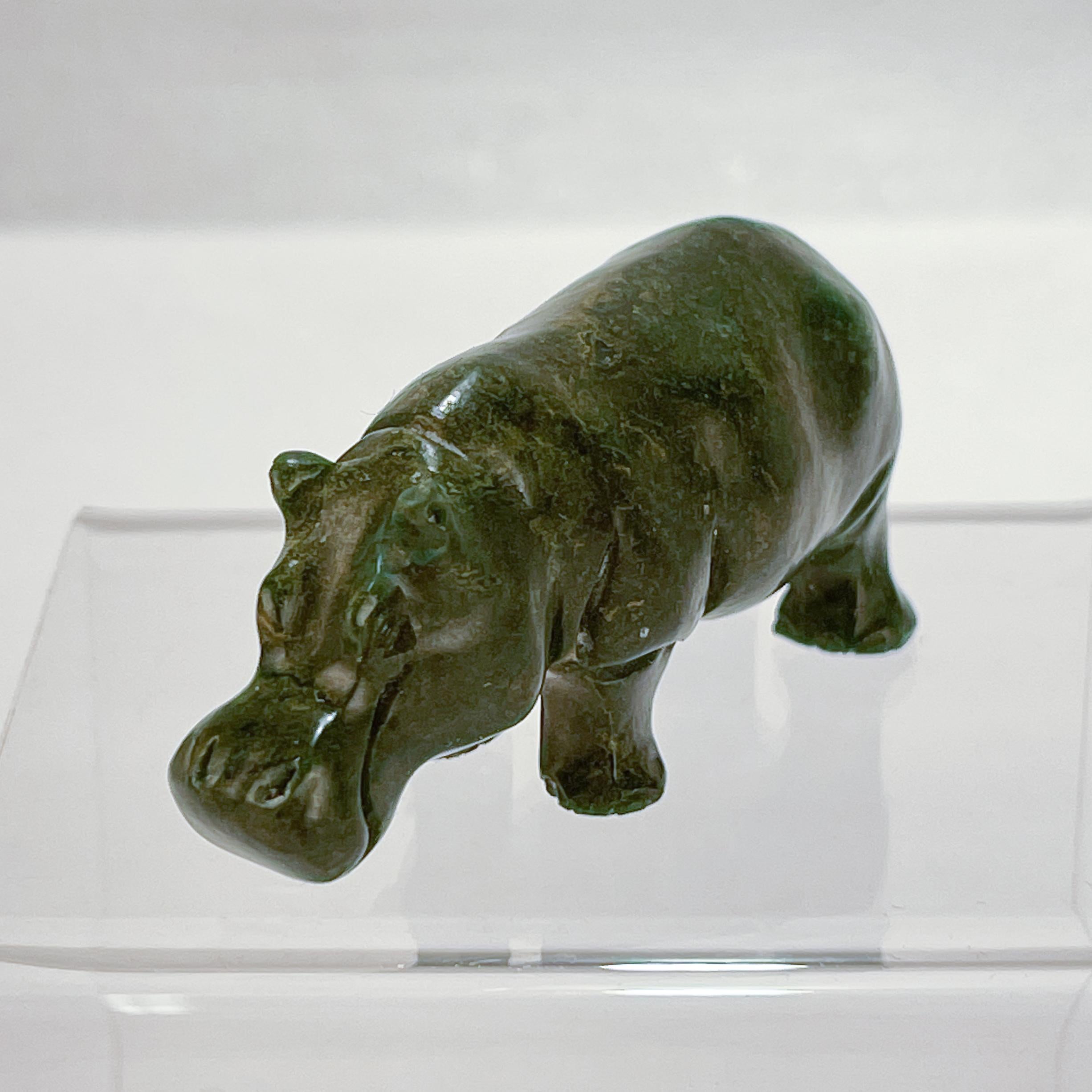 A very fine carved Nephrite Jade hippopotamus figurine.

Likely the work of the German lapidary carvers in Idar Oberstein (or possibly Russian in origin).

The feet of the hippo have numbered inscription or signature. 

Simply a great